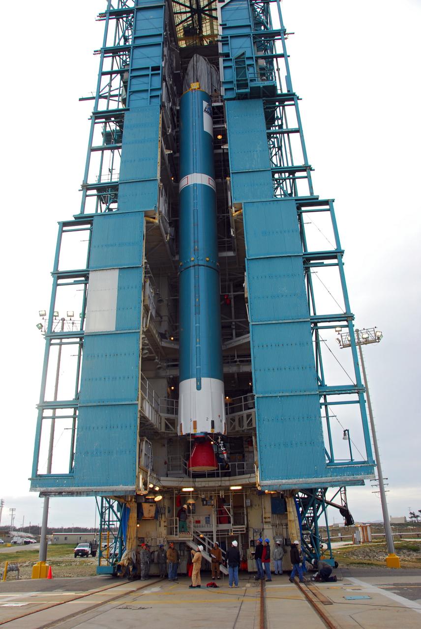 VANDENBERG AIR FORCE BASE, Calif. -- With the aid of an overhead crane, workers guide the first stage of the United Launch Alliance Delta II rocket that will carry the Aquarius/SAC-D spacecraft into low Earth orbit, into the service tower at NASA's Space Launch Complex-2 (SLC-2) at Vandenberg Air Force Base in California.             Following final tests, the spacecraft will be integrated to the Delta II in preparation for the targeted June launch. Aquarius, the NASA-built instrument on the SAC-D spacecraft, on its three-year mission, will provide new insights into how variations in ocean surface salinity relate to fundamental climate processes. Photo credit: NASA/VAFB