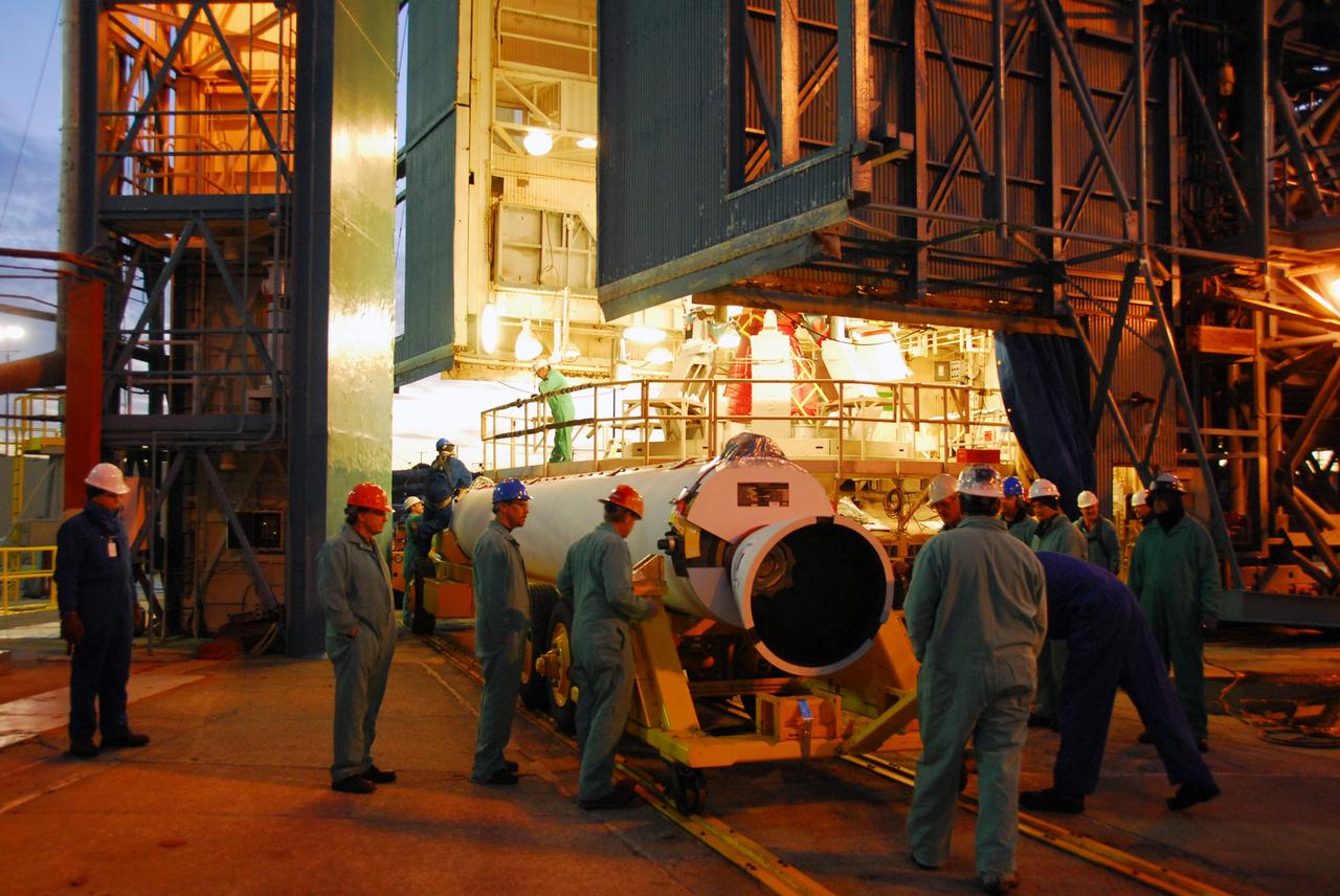 VANDENBERG AIR FORCE BASE, Calif. -- Workers prepare one of three United Launch Alliance Delta II solid rocket motors for its lift into the service tower at NASA's Space Launch Complex-2 (SLC-2) at Vandenberg Air Force Base in California.           Following final tests, the spacecraft will be integrated to the Delta II in preparation for the targeted June launch. Aquarius, the NASA-built instrument on the SAC-D spacecraft will provide new insights into how variations in ocean surface salinity relate to fundamental climate processes on its three-year mission. Photo credit: NASA/VAFB