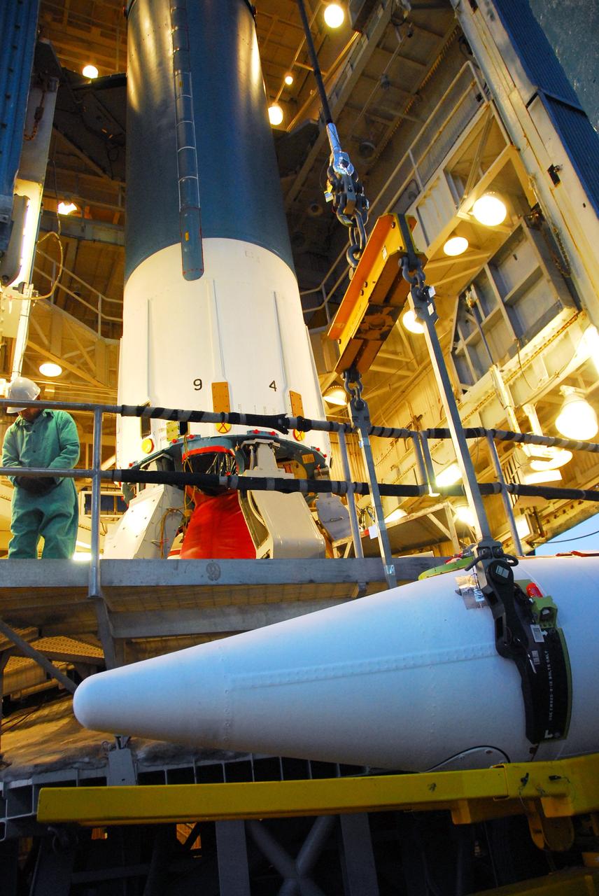 VANDENBERG AIR FORCE BASE, Calif. -- With the aid of an overhead crane workers lift one of three United Launch Alliance Delta II solid rocket motors into the service tower at NASA's Space Launch Complex-2 (SLC-2) at Vandenberg Air Force Base in California.         Following final tests, the spacecraft will be integrated to the Delta II in preparation for the targeted June launch. Aquarius, the NASA-built instrument on the SAC-D spacecraft will provide new insights into how variations in ocean surface salinity relate to fundamental climate processes on its three-year mission. Photo credit: NASA/VAFB
