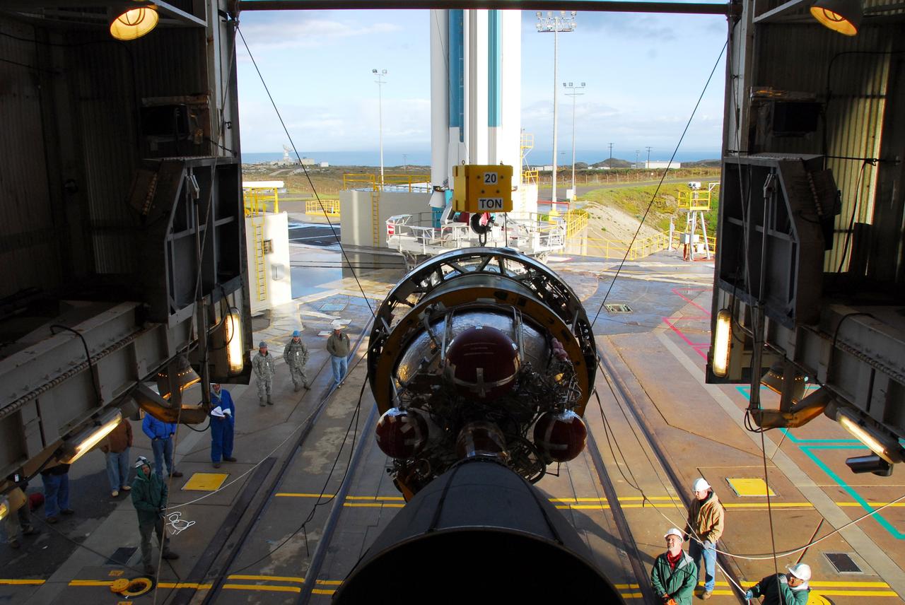 VANDENBERG AIR FORCE BASE, Calif. -- Workers attach cables from an overhead crane to the United Launch Alliance Delta II second stage motor for mating to the first stage at NASA's Space Launch Complex-2 (SLC-2) at Vandenberg Air Force Base in California.            Following final tests, the Aquarius/SAC-D spacecraft will be integrated to the Delta II launch vehicle in preparation for the targeted June liftoff. Aquarius, the NASA-built instrument on the SAC-D spacecraft will provide new insights into how variations in ocean surface salinity relate to fundamental climate processes on its three-year mission. Photo credit: NASA/VAFB
