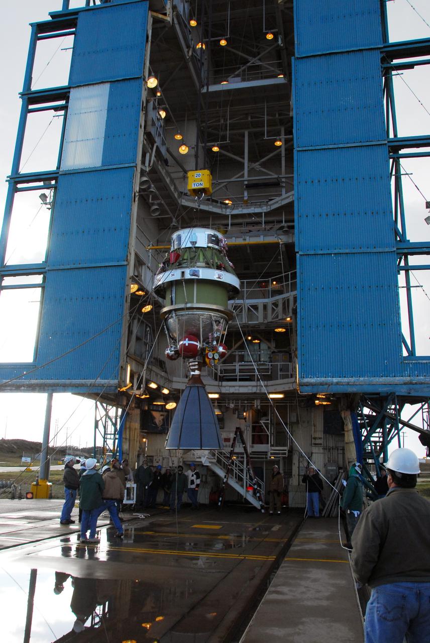 VANDENBERG AIR FORCE BASE, Calif. -- With the help of an overhead crane workers lift the United Launch Alliance Delta II second stage motor to the top of the service tower for mating with the first stage at NASA's Space Launch Complex-2 (SLC-2) at Vandenberg Air Force Base in California.          Following final tests, the Aquarius/SAC-D spacecraft will be integrated to the Delta II launch vehicle in preparation for the targeted June liftoff. Aquarius, the NASA-built instrument on the SAC-D spacecraft will provide new insights into how variations in ocean surface salinity relate to fundamental climate processes on its three-year mission. Photo credit: NASA/VAFB