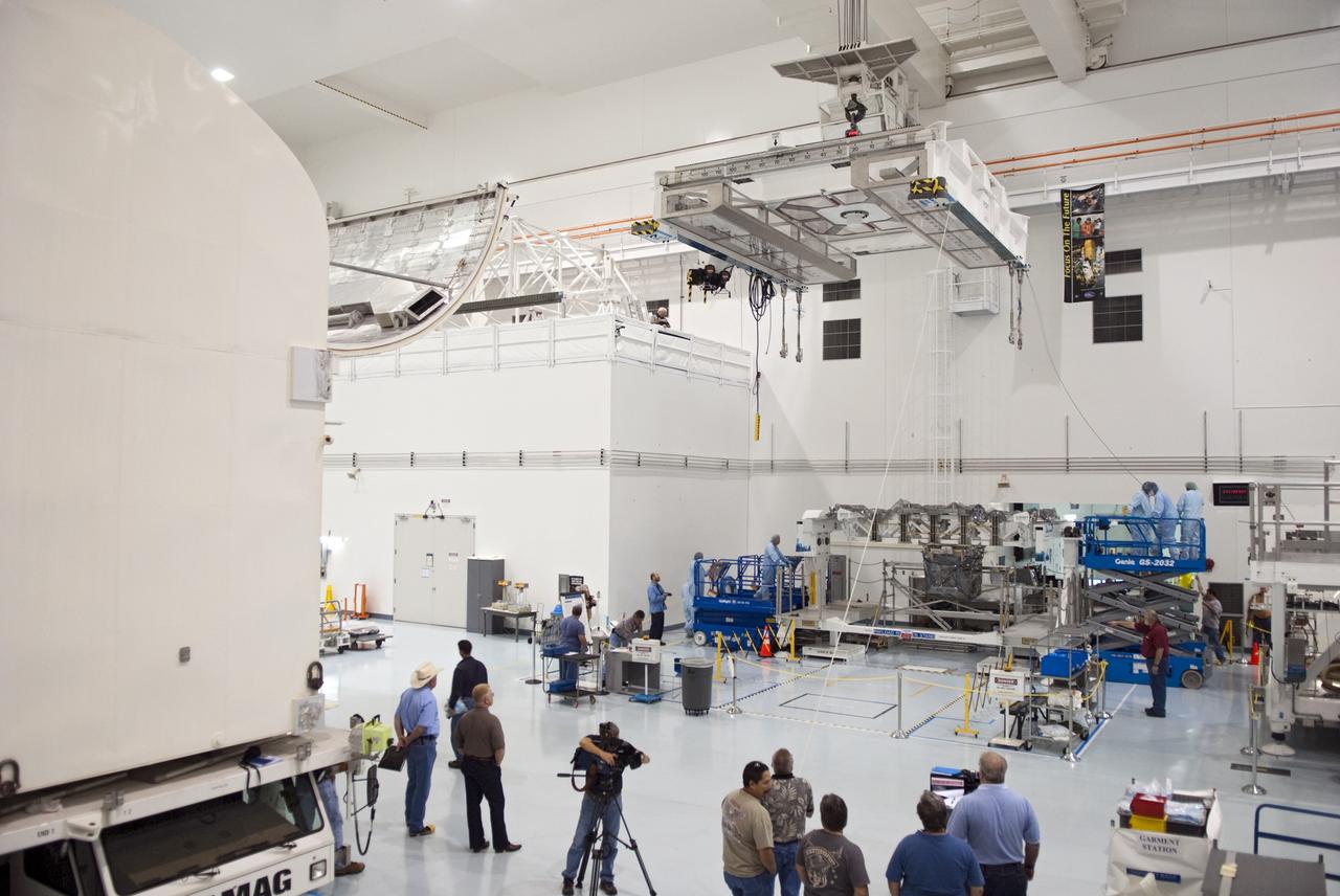 CAPE CANAVERAL, Fla. - In the Space Station Processing Facility at NASA's Kennedy Space Center in Florida technicians attach cables from an overhead crane to the Lightweight Multi-Purpose Experiment Support Structure Carrier, or LMC, for its move to a payload canister. The canister then will be installed into Atlantis' payload bay. Commander Chris Ferguson, Pilot Doug Hurley and Mission Specialists Sandra Magnus and Rex Walheim are targeted to lift off on July 8, taking with them the Raffaello multi-purpose logistics module packed with supplies, logistics and spare parts. The STS-135 mission also will fly a system to investigate the potential for robotically refueling existing spacecraft and return a failed ammonia pump module to help NASA better understand the failure mechanism and improve pump designs for future systems. STS-135 will be the 33rd flight of Atlantis, the 37th shuttle mission to the space station, and the 135th and final mission of NASA's Space Shuttle Program. For more information visit, www.nasa.gov/mission_pages/shuttle/shuttlemissions/sts135/index.html. Photo credit: NASA/Jim Grossmann