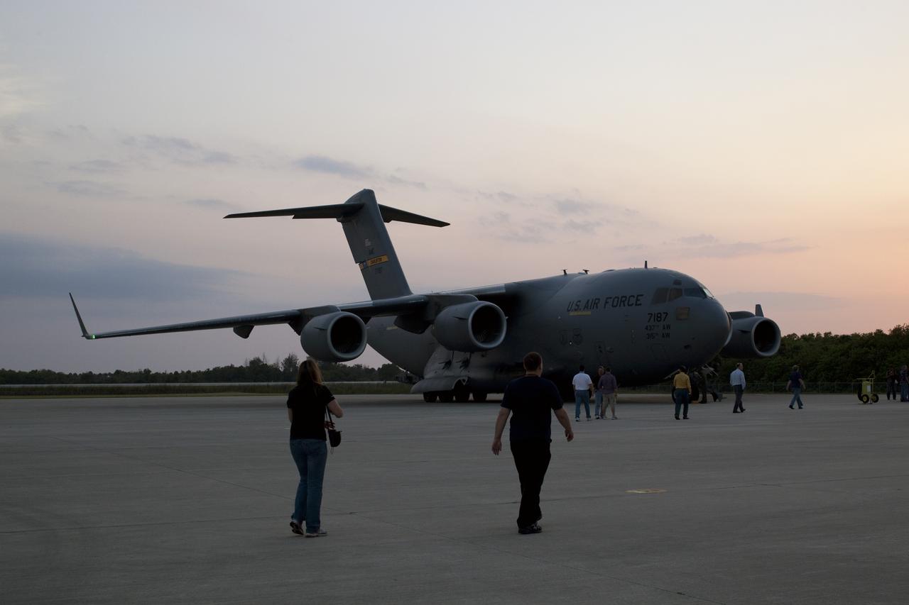 CAPE CANAVERAL, Fla. -- An Air Force C-17 cargo plane arrives on the Shuttle Landing Facility at NASA's Kennedy Space Center in Florida carrying the space agency's Gravity Recovery and Interior Laboratory, or GRAIL, spacecraft. The spacecraft traveled from the Lockheed Martin plant in Denver, Colo., and will undergo further processing in the Astrotech payload processing facility in Titusville, Fla. The United Launch Alliance Delta II rocket that will carry GRAIL into lunar orbit already is fully stacked at NASA's Space Launch Complex 17B and launch is scheduled for Sept. 8. The GRAIL mission is a part of NASA's Discovery Program. GRAIL will fly twin spacecraft in tandem orbits around the moon for several months to measure its gravity field. The mission also will answer longstanding questions about Earth's moon and provide scientists a better understanding of how Earth and other rocky planets in the solar system formed. For more information, visit http://science.nasa.gov/missions/grail/. Photo credit: NASA/Dimitri Gerondidakis