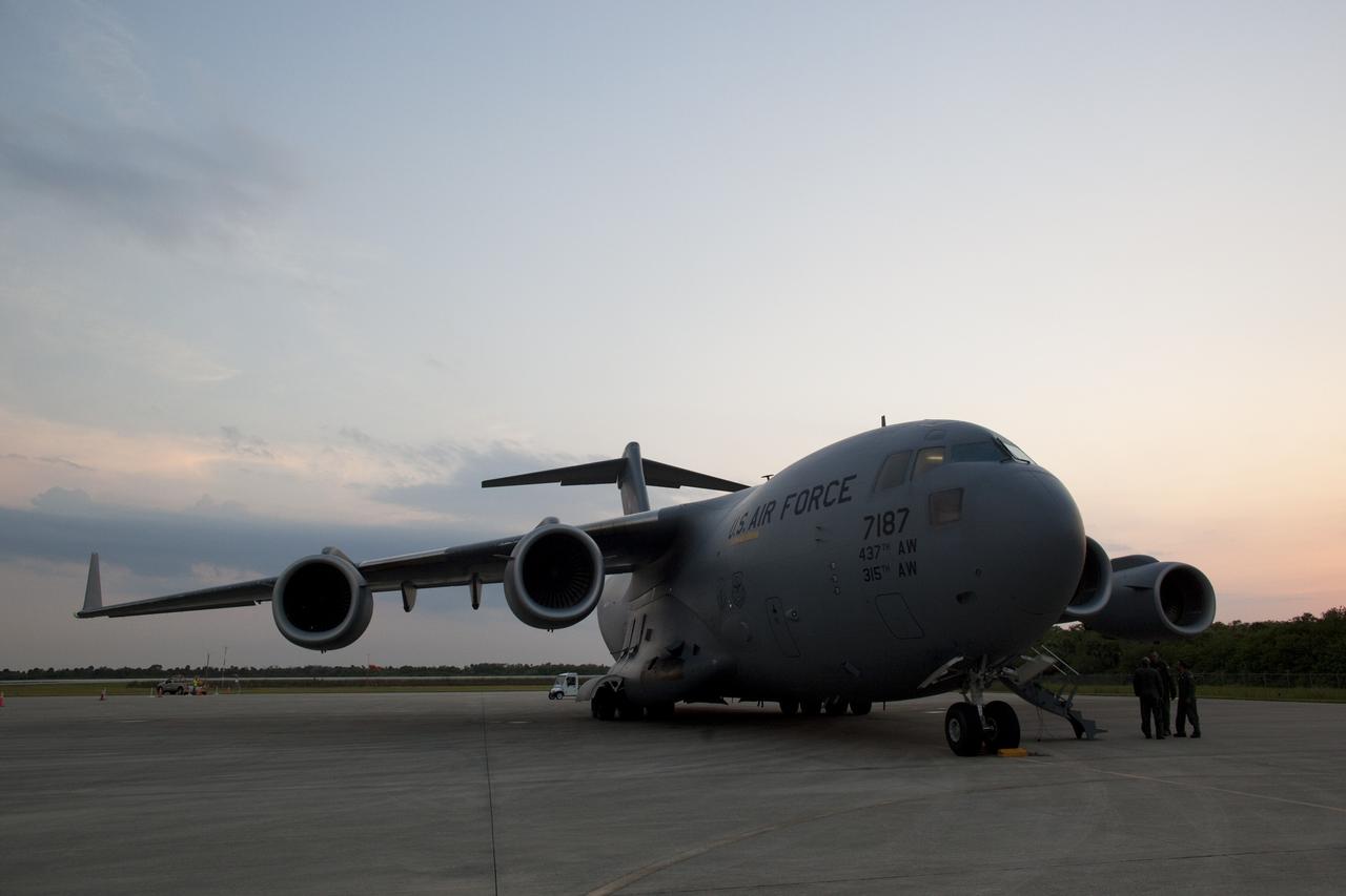 CAPE CANAVERAL, Fla. -- An Air Force C-17 cargo plane arrives on the Shuttle Landing Facility at NASA's Kennedy Space Center in Florida carrying the space agency's Gravity Recovery and Interior Laboratory, or GRAIL, spacecraft. The spacecraft traveled from the Lockheed Martin plant in Denver, Colo., and will undergo further processing in the Astrotech payload processing facility in Titusville, Fla. The United Launch Alliance Delta II rocket that will carry GRAIL into lunar orbit already is fully stacked at NASA's Space Launch Complex 17B and launch is scheduled for Sept. 8. The GRAIL mission is a part of NASA's Discovery Program. GRAIL will fly twin spacecraft in tandem orbits around the moon for several months to measure its gravity field. The mission also will answer longstanding questions about Earth's moon and provide scientists a better understanding of how Earth and other rocky planets in the solar system formed. For more information, visit http://science.nasa.gov/missions/grail/. Photo credit: NASA/Dimitri Gerondidakis