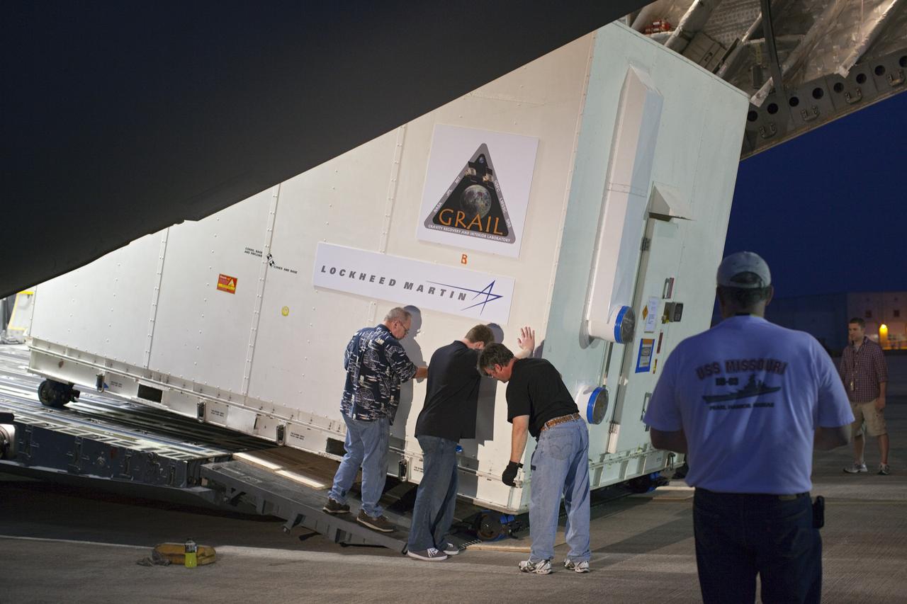CAPE CANAVERAL, Fla. -- NASA's Gravity Recovery and Interior Laboratory, or GRAIL, spacecraft is offloaded from an Air Force C-17 cargo plane on the Shuttle Landing Facility at Kennedy Space Center in Florida. The spacecraft traveled from the Lockheed Martin plant in Denver, Colo., and will undergo further processing in the Astrotech payload processing facility in Titusville, Fla. The United Launch Alliance Delta II rocket that will carry GRAIL into lunar orbit already is fully stacked at NASA's Space Launch Complex 17B and launch is scheduled for Sept. 8. The GRAIL mission is a part of NASA's Discovery Program. GRAIL will fly twin spacecraft in tandem orbits around the moon for several months to measure its gravity field. The mission also will answer longstanding questions about Earth's moon and provide scientists a better understanding of how Earth and other rocky planets in the solar system formed. For more information, visit http://science.nasa.gov/missions/grail/. Photo credit: NASA/Dimitri Gerondidakis