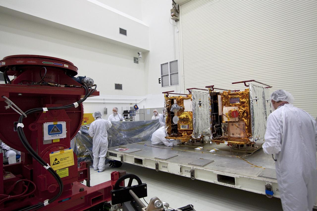 CAPE CANAVERAL, Fla. -- Technicians in the Astrotech payload processing facility in Titusville, Fla., prepare NASA's Gravity Recovery and Interior Laboratory, or GRAIL, twin spacecraft for testing and processing. GRAIL was built at the Lockheed Martin plant in Denver, Colo. The United Launch Alliance Delta II rocket that will carry GRAIL into lunar orbit already is fully stacked at NASA's Space Launch Complex 17B and launch is scheduled for Sept. 8.            The GRAIL mission is a part of NASA's Discovery Program. GRAIL will fly twin spacecraft in tandem orbits around the moon for several months to measure its gravity field. The mission also will answer longstanding questions about Earth's moon and provide scientists a better understanding of how Earth and other rocky planets in the solar system formed. For more information, visit http://science.nasa.gov/missions/grail/. Photo credit: NASA/Jack Pfaller