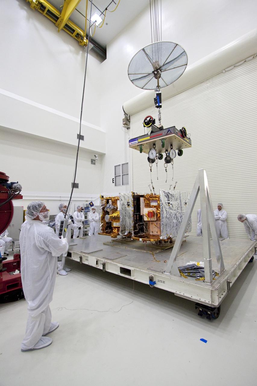 CAPE CANAVERAL, Fla. -- Technicians prepare to lift one of two spacecraft for NASA's Gravity Recovery and Interior Laboratory, or GRAIL, to a test stand in the Astrotech payload processing facility in Titusville, Fla. The twin spacecraft were built at the Lockheed Martin plant in Denver, Colo. The United Launch Alliance Delta II rocket that will carry GRAIL into lunar orbit already is fully stacked at NASA's Space Launch Complex 17B and launch is scheduled for Sept. 8.          The GRAIL mission is a part of NASA's Discovery Program. GRAIL will fly twin spacecraft in tandem orbits around the moon for several months to measure its gravity field. The mission also will answer longstanding questions about Earth's moon and provide scientists a better understanding of how Earth and other rocky planets in the solar system formed. For more information, visit http://science.nasa.gov/missions/grail/. Photo credit: NASA/Jack Pfaller
