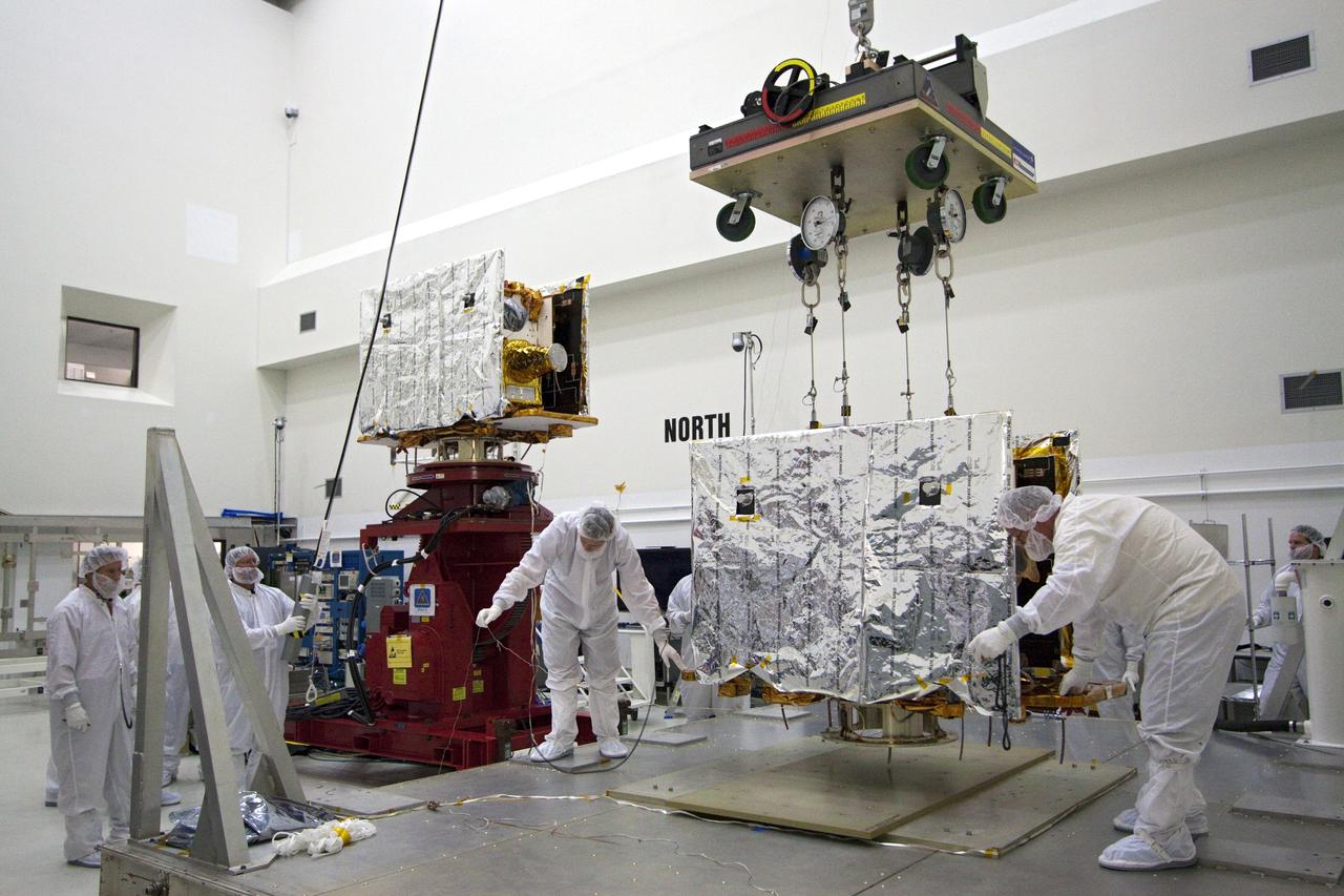 CAPE CANAVERAL, Fla. -- Technicians begin to lift one of two spacecraft for NASA's Gravity Recovery and Interior Laboratory, or GRAIL, to a test stand in the Astrotech payload processing facility in Titusville, Fla. The twin spacecraft were built at the Lockheed Martin plant in Denver, Colo. The United Launch Alliance Delta II rocket that will carry GRAIL into lunar orbit already is fully stacked at NASA's Space Launch Complex 17B and launch is scheduled for Sept. 8. The GRAIL mission is a part of NASA's Discovery Program. GRAIL will fly twin spacecraft in tandem orbits around the moon for several months to measure its gravity field. The mission also will answer longstanding questions about Earth's moon and provide scientists a better understanding of how Earth and other rocky planets in the solar system formed. For more information, visit http://science.nasa.gov/missions/grail/. Photo credit: NASA/Jack Pfaller