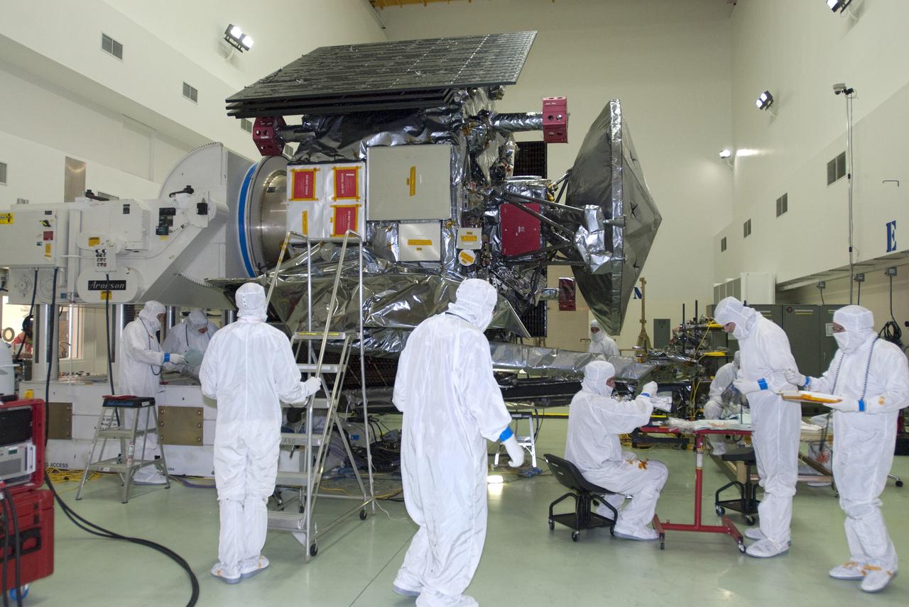 CAPE CANAVERAL, Fla. -- At Astrotech Space Operations in Titusville, Fla., technicians test the connections of solar array #1 with its magnetometer boom to NASA's Juno spacecraft after installation.        Juno is scheduled to launch aboard a United Launch Alliance Atlas V rocket from Cape Canaveral, Fla. Aug. 5.The solar-powered spacecraft will orbit Jupiter's poles 33 times to find out more about the gas giant's origins, structure, atmosphere and magnetosphere and investigate the existence of a solid planetary core. For more information visit: www.nasa.gov/juno. Photo credit: NASA/Charisse Nahser