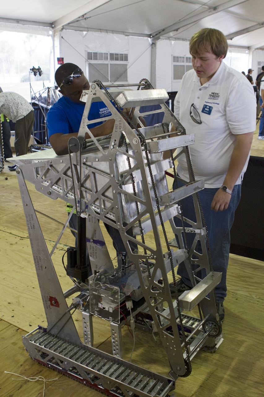 CAPE CANAVERAL, Fla. -- University students prepare for NASA's second annual Lunabotics Mining Competition at the Kennedy Space Center Visitor Complex in Florida.           Thirty-six teams of undergraduate and graduate students from the United States, Bangladesh, Canada, Colombia and India will participate in NASA's Lunabotics Mining Competition May 26 - 28. The competition is designed to engage and retain students in science, technology, engineering and mathematics (STEM). Teams will maneuver their remote controlled or autonomous excavators, called lunabots, in about 60 tons of ultra-fine simulated lunar soil, called BP-1. The competition is an Exploration Systems Mission Directorate project managed by Kennedy's Education Division. The event also provides a competitive environment that could result in innovative ideas and solutions for NASA's future excavation of the moon. Photo credit: NASA/Cory Huston
