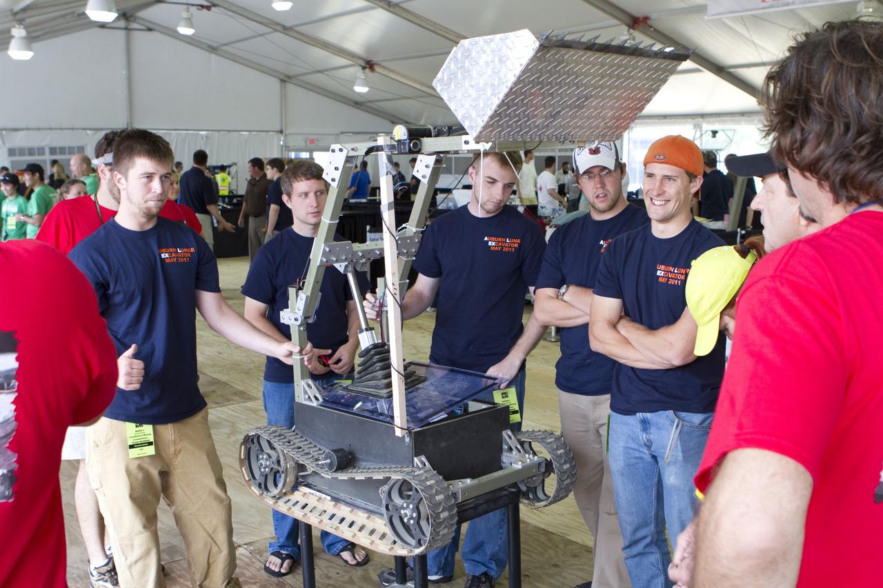 CAPE CANAVERAL, Fla. -- University students prepare for NASA's second annual Lunabotics Mining Competition at the Kennedy Space Center Visitor Complex in Florida.             Thirty-six teams of undergraduate and graduate students from the United States, Bangladesh, Canada, Colombia and India will participate in NASA's Lunabotics Mining Competition May 26 - 28. The competition is designed to engage and retain students in science, technology, engineering and mathematics (STEM). Teams will maneuver their remote controlled or autonomous excavators, called lunabots, in about 60 tons of ultra-fine simulated lunar soil, called BP-1. The competition is an Exploration Systems Mission Directorate project managed by Kennedy's Education Division. The event also provides a competitive environment that could result in innovative ideas and solutions for NASA's future excavation of the moon. Photo credit: NASA/Cory Huston
