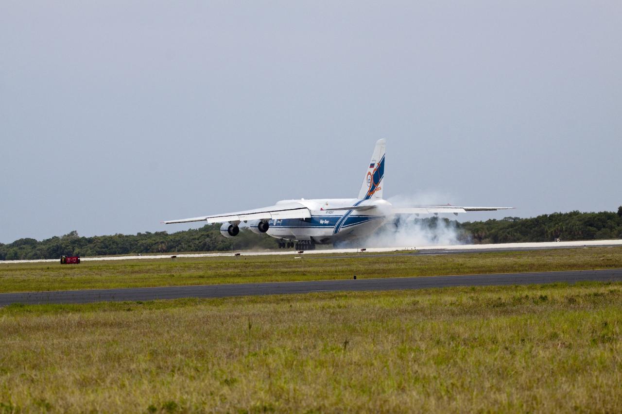 CAPE CANAVERAL, Fla. -- At Cape Canaveral Air Force Station in Florida, a Volga-Dnepr Antonov AN-124-100, a Ukranian/Russian cargo aircraft comes in for a landing on the Skid Strip. The aircraft is delivering the booster stage of a United Launch Alliance Atlas V rocket slated to launch NASA's Juno spacecraft Aug. 5. The solar-powered spacecraft will orbit Jupiter's poles 33 times to find out more about the gas giant's origins, structure, atmosphere and magnetosphere and investigate the existence of a solid planetary core. For more information visit: www.nasa.gov/juno. Photo credit: NASA/Jack Pfaller