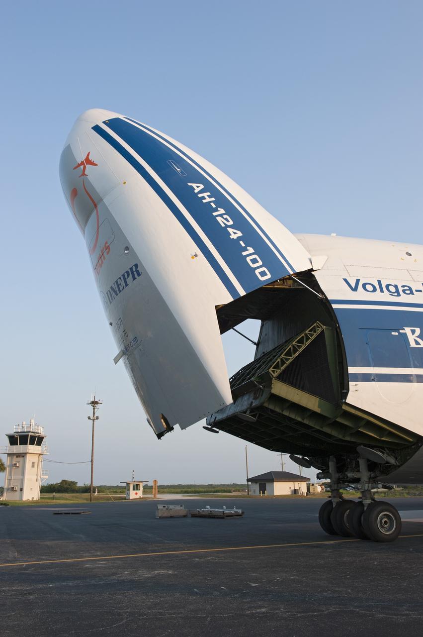 CAPE CANAVERAL, Fla. -- On the Skid Strip at Cape Canaveral Air Force Station in Florida, workers prepare to unload a Volga-Dnepr Antonov AN-124-100, a Ukranian/Russian cargo aircraft that has delivered the first stage of the United Launch Alliance Atlas V rocket slated to launch NASA's Juno spacecraft.    Juno is scheduled to launch aboard an Atlas V rocket from Cape Canaveral, Fla., Aug. 5.The solar-powered spacecraft will orbit Jupiter's poles 33 times to find out more about the gas giant's origins, structure, atmosphere and magnetosphere and investigate the existence of a solid planetary core.  For more information, visit www.nasa.gov/juno.  Photo credit: NASA/Kim Shiflett