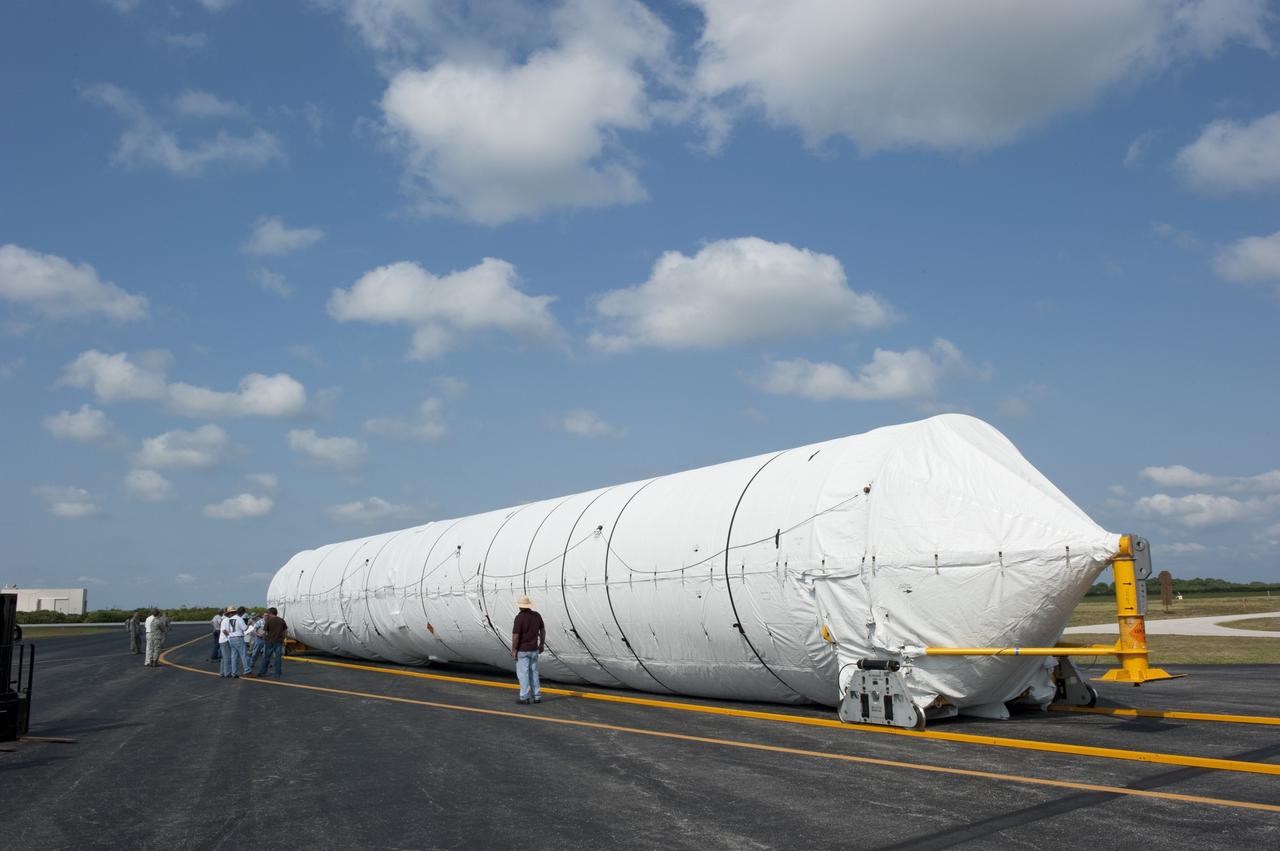 CAPE CANAVERAL, Fla. -- On the Skid Strip at Cape Canaveral Air Force Station in Florida, workers have unloaded the first stage of the United Launch Alliance Atlas V rocket slated to launch NASA's Juno spacecraft from a Volga-Dnepr Antonov AN-124-100, a Ukranian/Russian cargo aircraft.    Juno is scheduled to launch aboard an Atlas V rocket from Cape Canaveral, Fla., Aug. 5.The solar-powered spacecraft will orbit Jupiter's poles 33 times to find out more about the gas giant's origins, structure, atmosphere and magnetosphere and investigate the existence of a solid planetary core.  For more information, visit www.nasa.gov/juno.  Photo credit: NASA/Kim Shiflett
