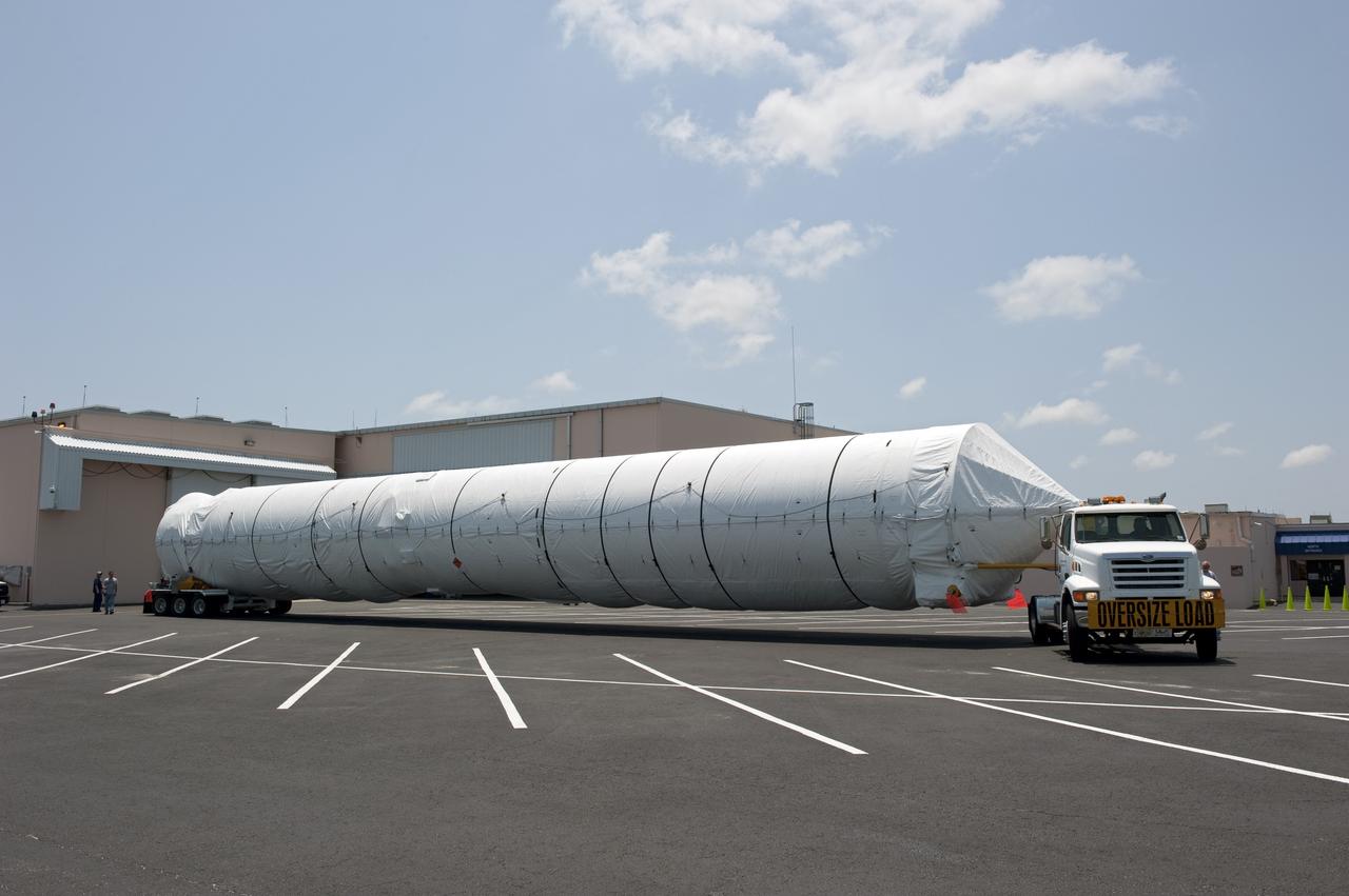 CAPE CANAVERAL, Fla. -- The first stage for the United Launch Alliance Atlas V rocket slated to launch NASA's Juno spacecraft has been transported from the Skid Strip on Cape Canaveral Air Force Station in Florida to the Atlas Spaceflight Operations Center.    Juno is scheduled to launch aboard an Atlas V rocket from Cape Canaveral, Fla., Aug. 5.The solar-powered spacecraft will orbit Jupiter's poles 33 times to find out more about the gas giant's origins, structure, atmosphere and magnetosphere and investigate the existence of a solid planetary core.  For more information, visit www.nasa.gov/juno.  Photo credit: NASA/Kim Shiflett