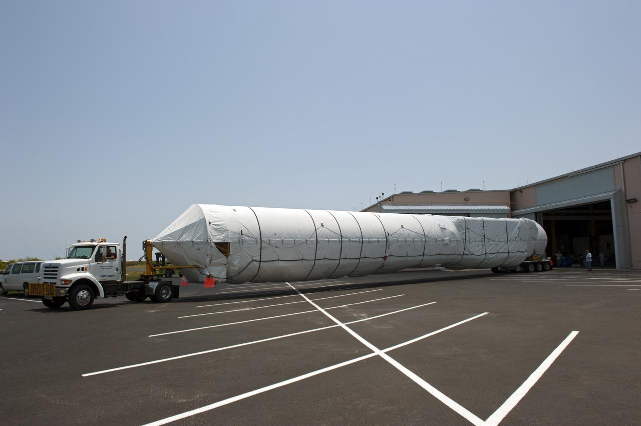 CAPE CANAVERAL, Fla. -- The first stage for the United Launch Alliance Atlas V rocket slated to launch NASA's Juno spacecraft has arrived at the Atlas Spaceflight Operations Center at Cape Canaveral Air Force Station in Florida.    Juno is scheduled to launch aboard an Atlas V rocket from Cape Canaveral, Fla., Aug. 5.The solar-powered spacecraft will orbit Jupiter's poles 33 times to find out more about the gas giant's origins, structure, atmosphere and magnetosphere and investigate the existence of a solid planetary core.  For more information, visit www.nasa.gov/juno.  Photo credit: NASA/Kim Shiflett