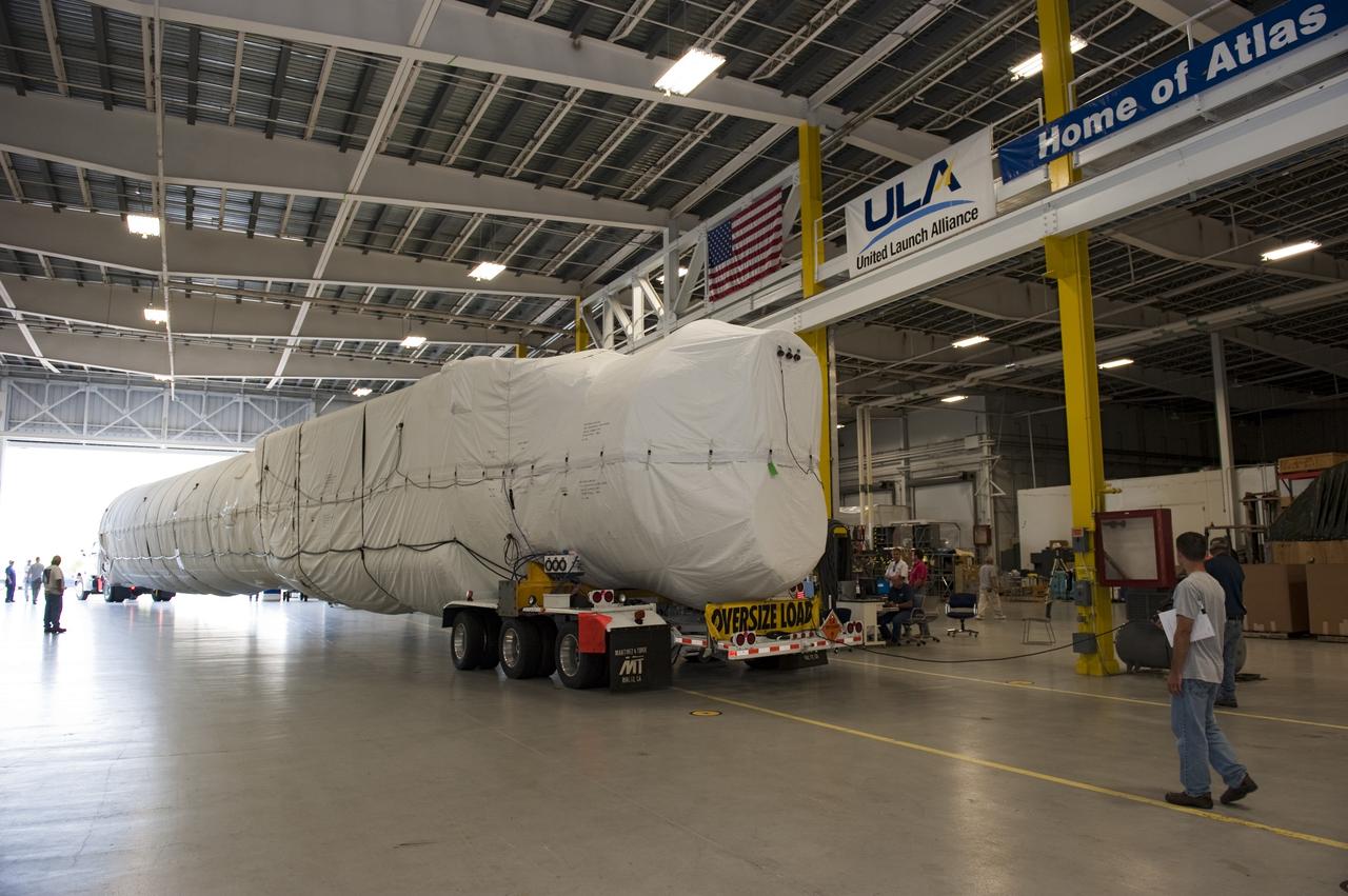 CAPE CANAVERAL, Fla. -- The first stage for the United Launch Alliance Atlas V rocket slated to launch NASA's Juno spacecraft has arrived at the Atlas Spaceflight Operations Center at Cape Canaveral Air Force Station in Florida.    Juno is scheduled to launch aboard an Atlas V rocket from Cape Canaveral, Fla., Aug. 5.The solar-powered spacecraft will orbit Jupiter's poles 33 times to find out more about the gas giant's origins, structure, atmosphere and magnetosphere and investigate the existence of a solid planetary core.  For more information, visit www.nasa.gov/juno.  Photo credit: NASA/Kim Shiflett