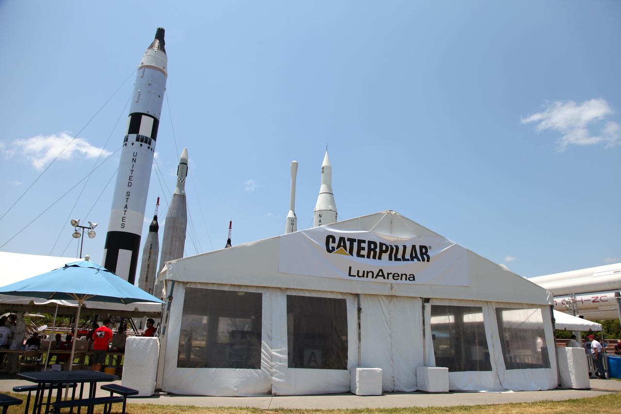 CAPE CANAVERAL, Fla. -- This tent called a "Lunarena" is a giant "sandbox," with about 60 tons of ultra-fine simulated lunar soil spread on the floor for NASA's second annual Lunabotics Mining Competition at the Kennedy Space Center Visitor Complex.        Thirty-six teams of undergraduate and graduate students from the United States, Bangladesh, Canada, Colombia and India will participate in NASA's Lunabotics Mining Competition May 26 - 28 at the agency's Kennedy Space Center in Florida. The competition is designed to engage and retain students in science, technology, engineering and mathematics (STEM). Teams will maneuver their remote controlled or autonomous excavators, called lunabots, in about 60 tons of ultra-fine simulated lunar soil, called BP-1. The competition is an Exploration Systems Mission Directorate project managed by Kennedy's Education Division. The event also provides a competitive environment that could result in innovative ideas and solutions for NASA's future excavation of the moon. Photo credit: NASA/Frankie Martin