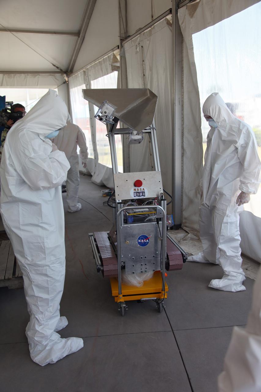 CAPE CANAVERAL, Fla. -- University students prepare for NASA's second annual Lunabotics Mining Competition at the Kennedy Space Center Visitor Complex in Florida.         Thirty-six teams of undergraduate and graduate students from the United States, Bangladesh, Canada, Colombia and India will participate in NASA's Lunabotics Mining Competition May 26 - 28 at the agency's Kennedy Space Center in Florida. The competition is designed to engage and retain students in science, technology, engineering and mathematics (STEM). Teams will maneuver their remote controlled or autonomous excavators, called lunabots, in about 60 tons of ultra-fine simulated lunar soil, called BP-1. The competition is an Exploration Systems Mission Directorate project managed by Kennedy's Education Division. The event also provides a competitive environment that could result in innovative ideas and solutions for NASA's future excavation of the moon. Photo credit: NASA/Frankie Martin