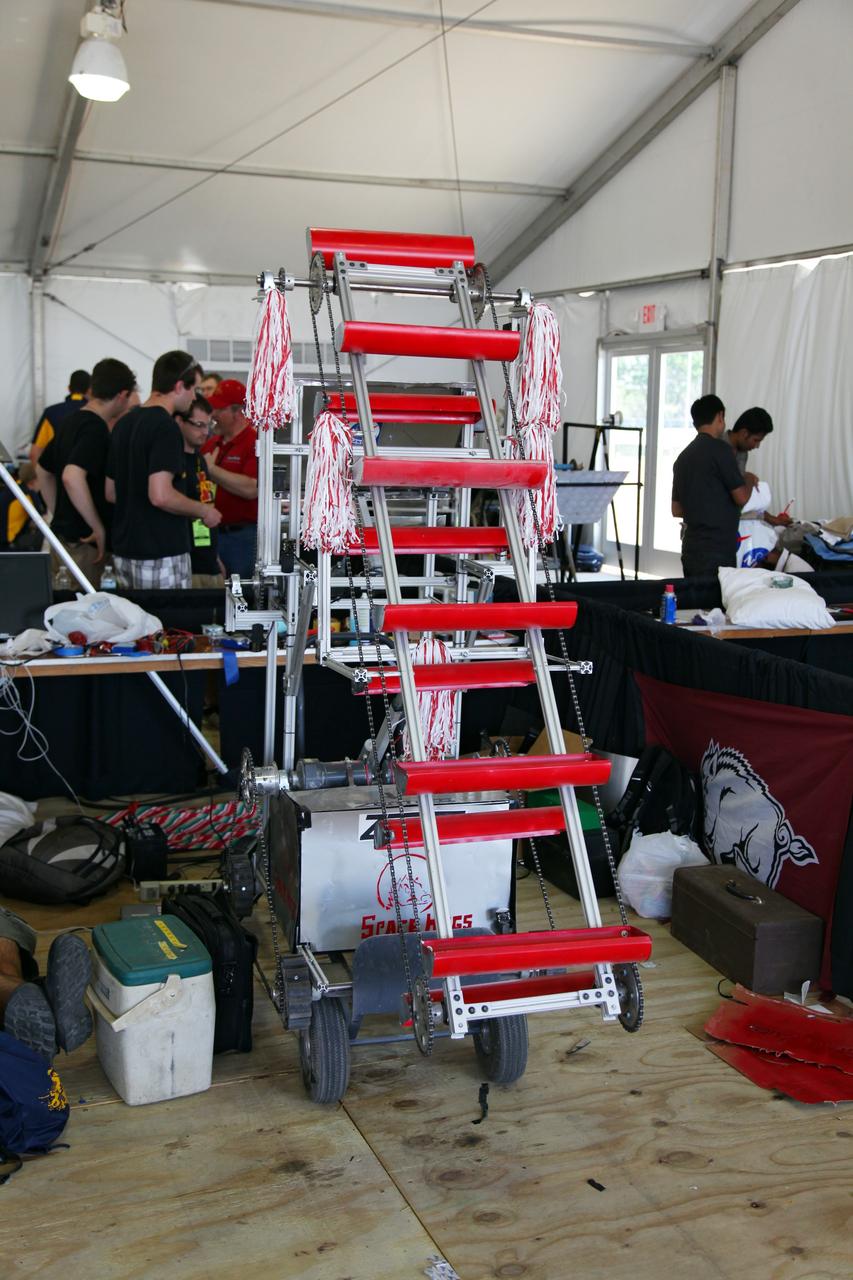 CAPE CANAVERAL, Fla. -- University students prepare for NASA's second annual Lunabotics Mining Competition at the Kennedy Space Center Visitor Complex in Florida.       Thirty-six teams of undergraduate and graduate students from the United States, Bangladesh, Canada, Colombia and India will participate in NASA's Lunabotics Mining Competition May 26 - 28 at the agency's Kennedy Space Center in Florida. The competition is designed to engage and retain students in science, technology, engineering and mathematics (STEM). Teams will maneuver their remote controlled or autonomous excavators, called lunabots, in about 60 tons of ultra-fine simulated lunar soil, called BP-1. The competition is an Exploration Systems Mission Directorate project managed by Kennedy's Education Division. The event also provides a competitive environment that could result in innovative ideas and solutions for NASA's future excavation of the moon. Photo credit: NASA/Frankie Martin