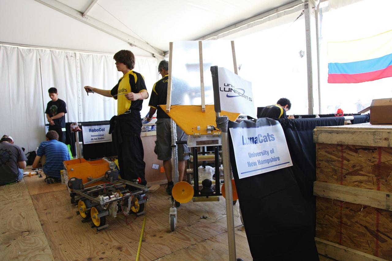 CAPE CANAVERAL, Fla. -- University students prepare for NASA's second annual Lunabotics Mining Competition at the Kennedy Space Center Visitor Complex in Florida.       Thirty-six teams of undergraduate and graduate students from the United States, Bangladesh, Canada, Colombia and India will participate in NASA's Lunabotics Mining Competition May 26 - 28 at the agency's Kennedy Space Center in Florida. The competition is designed to engage and retain students in science, technology, engineering and mathematics (STEM). Teams will maneuver their remote controlled or autonomous excavators, called lunabots, in about 60 tons of ultra-fine simulated lunar soil, called BP-1. The competition is an Exploration Systems Mission Directorate project managed by Kennedy's Education Division. The event also provides a competitive environment that could result in innovative ideas and solutions for NASA's future excavation of the moon. Photo credit: NASA/Frankie Martin