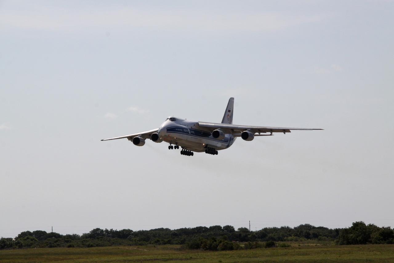 CAPE CANAVERAL, Fla. -- At Cape Canaveral Air Force Station in Florida, a Volga-Dnepr Antonov AN-124-100, Ukranian/Russian cargo aircraft comes in for a landing on the Skid Strip. The aircraft is delivering the Centaur upper stage of a United Launch Alliance Atlas V rocket.          NASA's Juno spacecraft is scheduled to launch aboard the Atlas V from Cape Canaveral, Fla. Aug. 5.The solar-powered spacecraft will orbit Jupiter's poles 33 times to find out more about the gas giant's origins, structure, atmosphere and magnetosphere and investigate the existence of a solid planetary core. For more information visit: www.nasa.gov/juno. Photo credit: NASA/Jack Pfaller