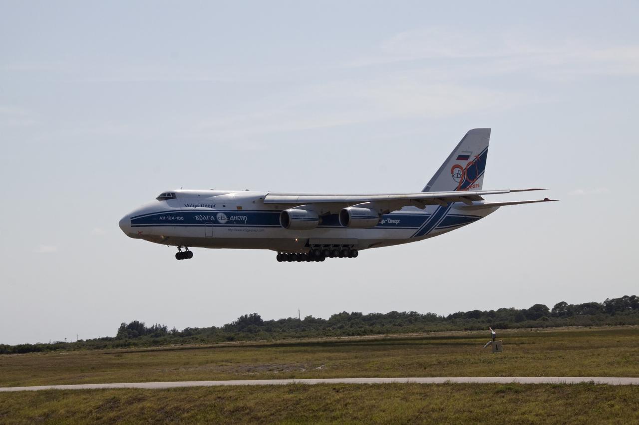 CAPE CANAVERAL, Fla. -- At Cape Canaveral Air Force Station in Florida, a Volga-Dnepr Antonov AN-124-100, Ukranian/Russian cargo aircraft comes in for a landing on the Skid Strip. The aircraft is delivering the Centaur upper stage of a United Launch Alliance Atlas V rocket. NASA's Juno spacecraft is scheduled to launch aboard the Atlas V from Cape Canaveral, Fla. Aug. 5.The solar-powered spacecraft will orbit Jupiter's poles 33 times to find out more about the gas giant's origins, structure, atmosphere and magnetosphere and investigate the existence of a solid planetary core. For more information visit: www.nasa.gov/juno. Photo credit: NASA/Jack Pfaller