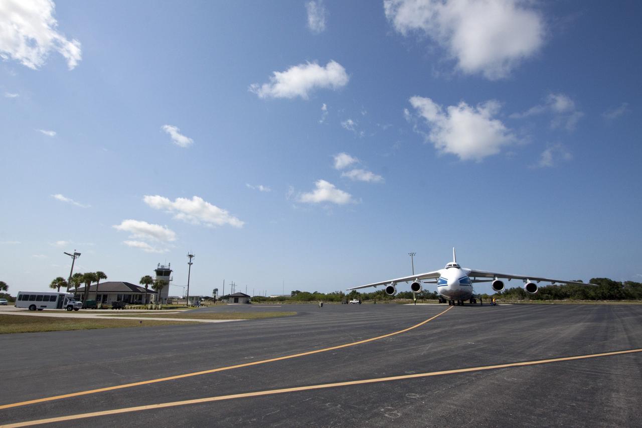 CAPE CANAVERAL, Fla. -- At Cape Canaveral Air Force Station in Florida, a Volga-Dnepr Antonov AN-124-100, Ukranian/Russian cargo aircraft has landed on the Skid Strip. The aircraft is delivering the Centaur upper stage of a United Launch Alliance Atlas V rocket. NASA's Juno spacecraft is scheduled to launch aboard the Atlas V from Cape Canaveral, Fla. Aug. 5.The solar-powered spacecraft will orbit Jupiter's poles 33 times to find out more about the gas giant's origins, structure, atmosphere and magnetosphere and investigate the existence of a solid planetary core. For more information visit: www.nasa.gov/juno. Photo credit: NASA/Jack Pfaller