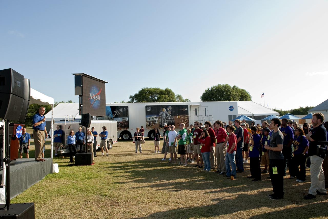 CAPE CANAVERAL, Fla. -- Pat Simpkins, Kennedy Space Center engineering director talks to university students gathered for the opening ceremony of NASA's second annual Lunabotics Mining Competition at the Kennedy Space Center Visitor Complex in Florida.      Thirty-six teams of undergraduate and graduate students from the United States, Bangladesh, Canada, Colombia and India will participate in NASA's Lunabotics Mining Competition May 26 - 28 at the agency's Kennedy Space Center in Florida. The competition is designed to engage and retain students in science, technology, engineering and mathematics (STEM). Teams will maneuver their remote controlled or autonomous excavators, called lunabots, in about 60 tons of ultra-fine simulated lunar soil, called BP-1. The competition is an Exploration Systems Mission Directorate project managed by Kennedy's Education Division. The event also provides a competitive environment that could result in innovative ideas and solutions for NASA's future excavation of the moon. Photo credit: NASA/Jim Grossmann