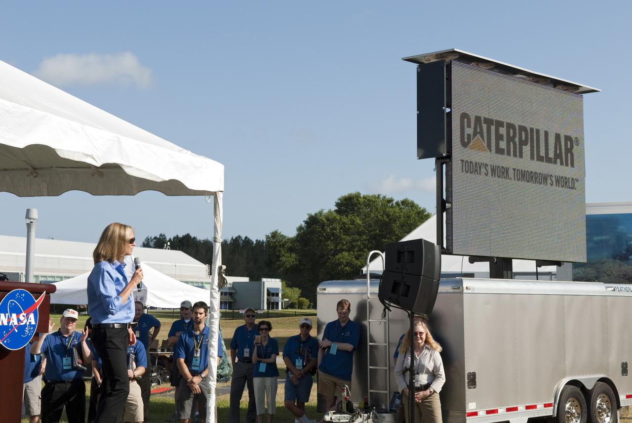CAPE CANAVERAL, Fla. -- Tana Utley, Caterpillar Company vice president and chief technology officer talks to university students gathered for the opening ceremony of NASA's second annual Lunabotics Mining Competition at the Kennedy Space Center Visitor Complex in Florida. Thirty-six teams of undergraduate and graduate students from the United States, Bangladesh, Canada, Colombia and India will participate in NASA's Lunabotics Mining Competition May 26 - 28 at the agency's Kennedy Space Center in Florida. The competition is designed to engage and retain students in science, technology, engineering and mathematics (STEM). Teams will maneuver their remote controlled or autonomous excavators, called lunabots, in about 60 tons of ultra-fine simulated lunar soil, called BP-1. The competition is an Exploration Systems Mission Directorate project managed by Kennedy's Education Division. The event also provides a competitive environment that could result in innovative ideas and solutions for NASA's future excavation of the moon. Photo credit: NASA/Jim Grossmann