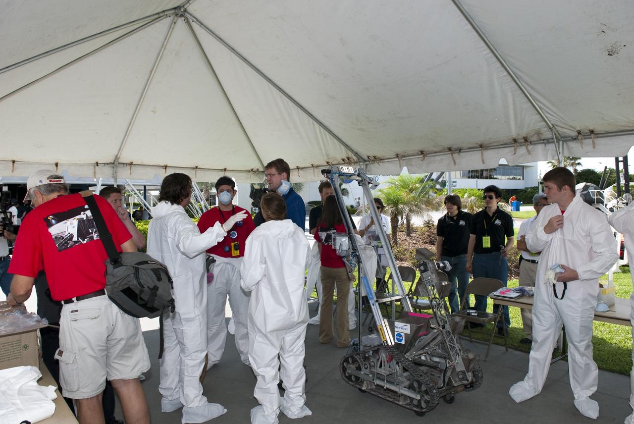 CAPE CANAVERAL, Fla. -- University students make final preparations for NASA's second annual Lunabotics Mining Competition at the Kennedy Space Center Visitor Complex in Florida.       Thirty-six teams of undergraduate and graduate students from the United States, Bangladesh, Canada, Colombia and India will participate in NASA's Lunabotics Mining Competition May 26 - 28 at the agency's Kennedy Space Center in Florida. The competition is designed to engage and retain students in science, technology, engineering and mathematics (STEM). Teams will maneuver their remote controlled or autonomous excavators, called lunabots, in about 60 tons of ultra-fine simulated lunar soil, called BP-1. The competition is an Exploration Systems Mission Directorate project managed by Kennedy's Education Division. The event also provides a competitive environment that could result in innovative ideas and solutions for NASA's future excavation of the moon. Photo credit: NASA/Jim Grossmann