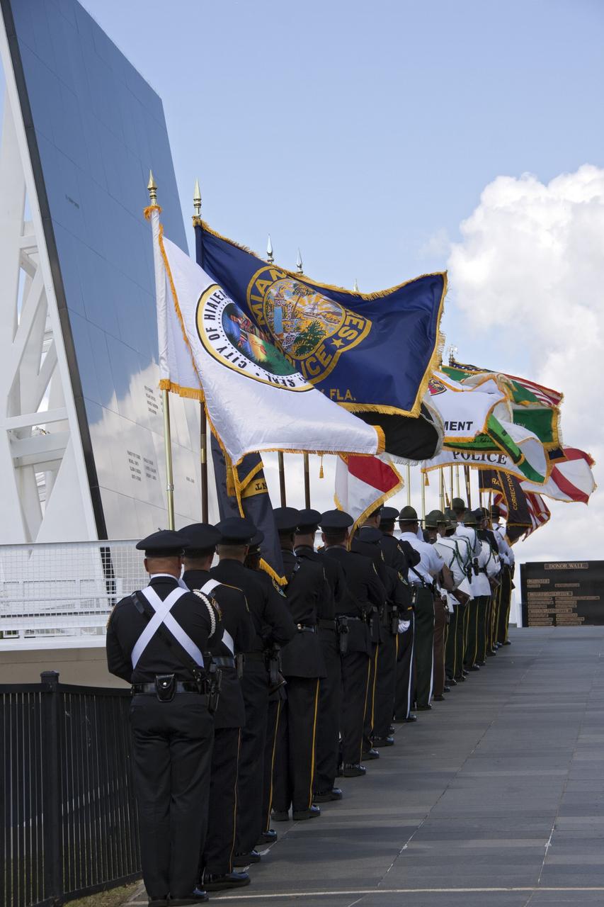 CAPE CANAVERAL, Fla. -- Honor guards march to the Astronaut Memorial Mirror at NASA's Kennedy Space Center Visitor Complex to participate in a U.S. Honor Flag presentation ceremony.           The flag is presented to NASA to be prepared to fly aboard space shuttle Atlantis on the Space Shuttle Program's final mission, STS-135. The U.S. Honor Flag has been flown nationwide, at Ground Zero and throughout the world to honor heroes who have lost their lives while serving their community and country, including police officers, firefighters, members of the Armed Forces and astronauts. More than 100 honor guard members traveled to the Space Coast to take part in the ceremony. After the flag returns to Earth, it will continue as a traveling memorial. Photo credit: NASA/Troy Cryder