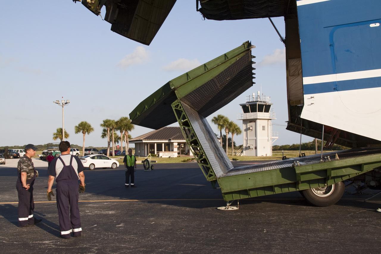 CAPE CANAVERAL, Fla. -- On the Skid Strip at Cape Canaveral Air Force Station in Florida, workers prepare to unload a Volga-Dnepr Antonov AN-124-100, a Ukranian/Russian cargo aircraft that has delivered the Centaur upper stage of the United Launch Alliance Atlas V rocket slated to launch NASA's Juno spacecraft. NASA's Juno spacecraft is scheduled to launch aboard the Atlas V from Cape Canaveral, Fla. Aug. 5.The solar-powered spacecraft will orbit Jupiter's poles 33 times to find out more about the gas giant's origins, structure, atmosphere and magnetosphere and investigate the existence of a solid planetary core. For more information visit: www.nasa.gov/juno. Photo credit: NASA/Jack Pfaller