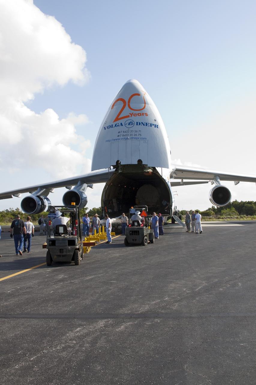 CAPE CANAVERAL, Fla. -- On the Skid Strip at Cape Canaveral Air Force Station in Florida, workers prepare to unload a Volga-Dnepr Antonov AN-124-100, a Ukranian/Russian cargo aircraft that has delivered the Centaur upper stage of the United Launch Alliance Atlas V rocket slated to launch NASA's Juno spacecraft. NASA's Juno spacecraft is scheduled to launch aboard the Atlas V from Cape Canaveral, Fla. Aug. 5.The solar-powered spacecraft will orbit Jupiter's poles 33 times to find out more about the gas giant's origins, structure, atmosphere and magnetosphere and investigate the existence of a solid planetary core. For more information visit: www.nasa.gov/juno. Photo credit: NASA/Jack Pfaller