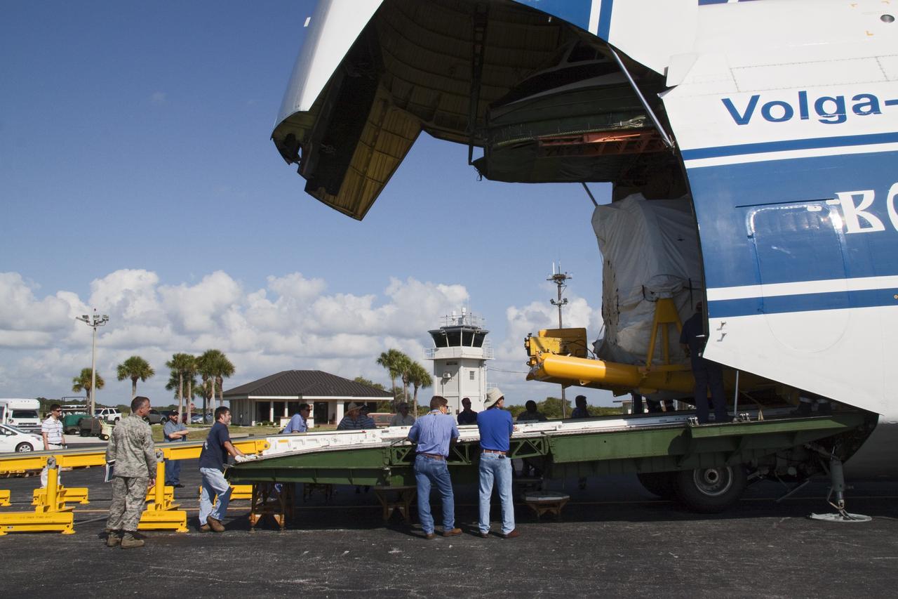 CAPE CANAVERAL, Fla. -- On the Skid Strip at Cape Canaveral Air Force Station in Florida, workers begin to unload the Centaur upper stage of the United Launch Alliance Atlas V rocket slated to launch NASA's Juno spacecraft from a Volga-Dnepr Antonov AN-124-100, a Ukranian/Russian cargo aircraft. NASA's Juno spacecraft is scheduled to launch aboard the Atlas V from Cape Canaveral, Fla. Aug. 5.The solar-powered spacecraft will orbit Jupiter's poles 33 times to find out more about the gas giant's origins, structure, atmosphere and magnetosphere and investigate the existence of a solid planetary core. For more information visit: www.nasa.gov/juno. Photo credit: NASA/Jack Pfaller