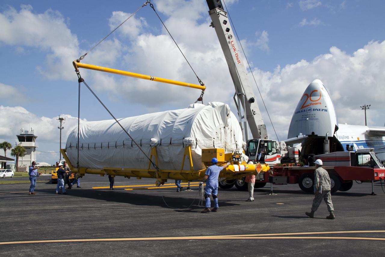 CAPE CANAVERAL, Fla. -- On the Skid Strip at Cape Canaveral Air Force Station in Florida, workers  use a crane to lift the Centaur upper stage of the United Launch Alliance Atlas V rocket slated to launch NASA's Juno spacecraft onto a transporter.          NASA's Juno spacecraft is scheduled to launch aboard the Atlas V from Cape Canaveral, Fla. Aug. 5.The solar-powered spacecraft will orbit Jupiter's poles 33 times to find out more about the gas giant's origins, structure, atmosphere and magnetosphere and investigate the existence of a solid planetary core. For more information visit: www.nasa.gov/juno. Photo credit: NASA/Jack Pfaller