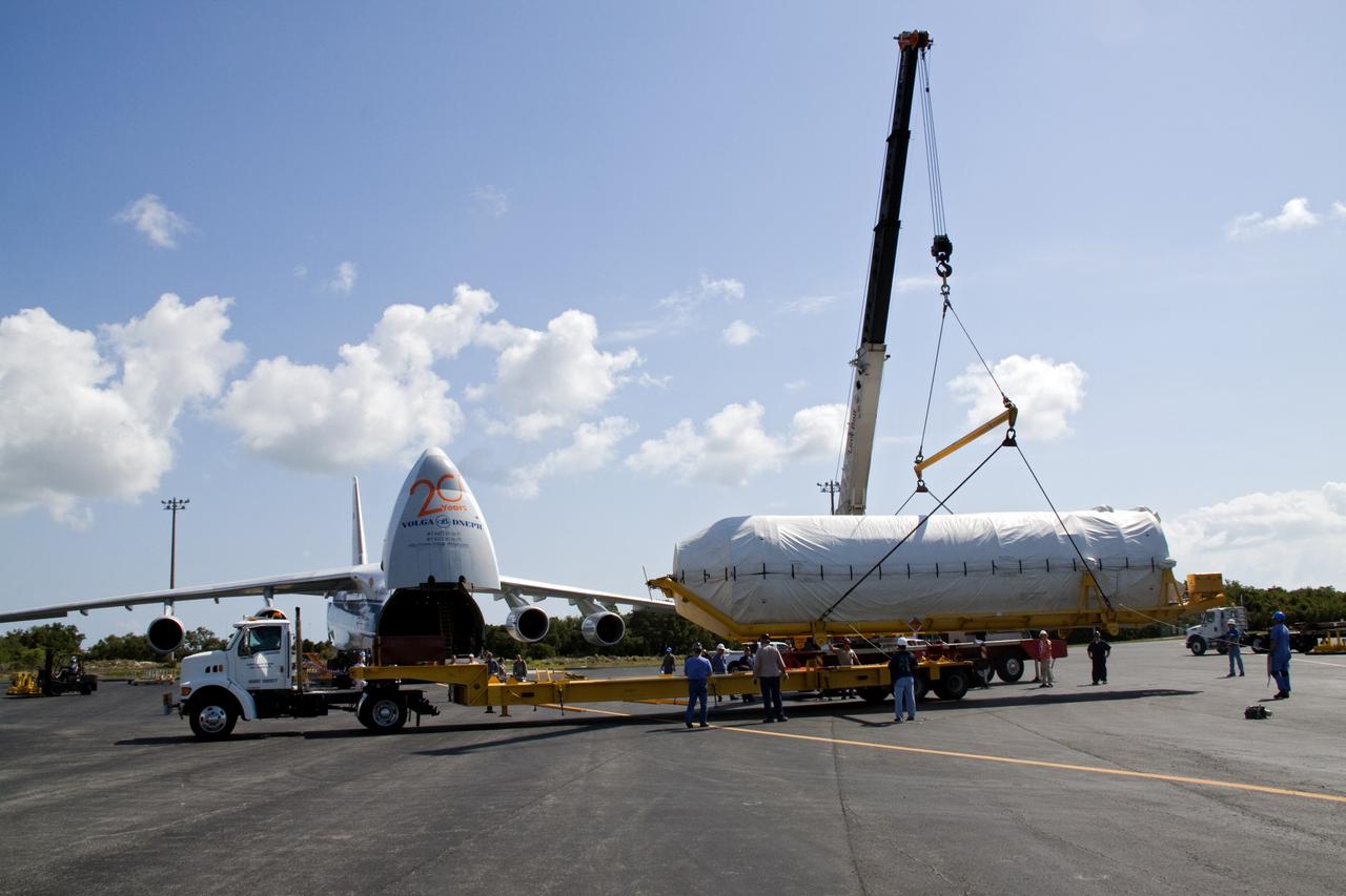CAPE CANAVERAL, Fla. -- On the Skid Strip at Cape Canaveral Air Force Station in Florida, workers use a crane to lower the Centaur upper stage of the United Launch Alliance Atlas V rocket slated to launch NASA's Juno spacecraft onto a transporter.        NASA's Juno spacecraft is scheduled to launch aboard the Atlas V from Cape Canaveral, Fla. Aug. 5.The solar-powered spacecraft will orbit Jupiter's poles 33 times to find out more about the gas giant's origins, structure, atmosphere and magnetosphere and investigate the existence of a solid planetary core. For more information visit: www.nasa.gov/juno. Photo credit: NASA/Jack Pfaller