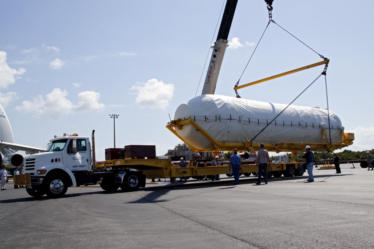 CAPE CANAVERAL, Fla. -- On the Skid Strip at Cape Canaveral Air Force Station in Florida, workers use a crane to lower the Centaur upper stage of the United Launch Alliance Atlas V rocket slated to launch NASA's Juno spacecraft onto a transporter.        NASA's Juno spacecraft is scheduled to launch aboard the Atlas V from Cape Canaveral, Fla. Aug. 5.The solar-powered spacecraft will orbit Jupiter's poles 33 times to find out more about the gas giant's origins, structure, atmosphere and magnetosphere and investigate the existence of a solid planetary core. For more information visit: www.nasa.gov/juno. Photo credit: NASA/Jack Pfaller