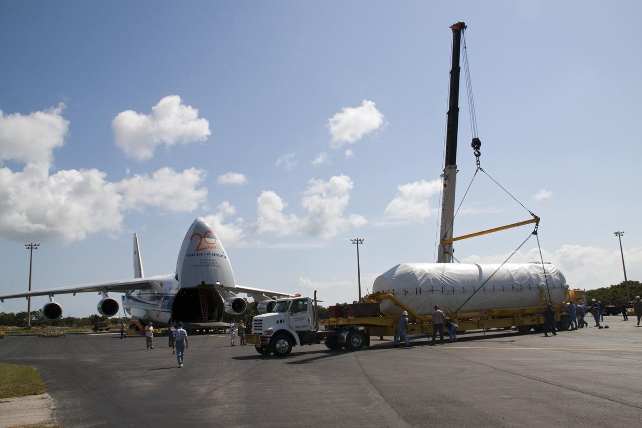 CAPE CANAVERAL, Fla. -- On the Skid Strip at Cape Canaveral Air Force Station in Florida, workers use a crane to lower the Centaur upper stage of the United Launch Alliance Atlas V rocket slated to launch NASA's Juno spacecraft onto a transporter.        NASA's Juno spacecraft is scheduled to launch aboard the Atlas V from Cape Canaveral, Fla. Aug. 5.The solar-powered spacecraft will orbit Jupiter's poles 33 times to find out more about the gas giant's origins, structure, atmosphere and magnetosphere and investigate the existence of a solid planetary core. For more information visit: www.nasa.gov/juno. Photo credit: NASA/Jack Pfaller