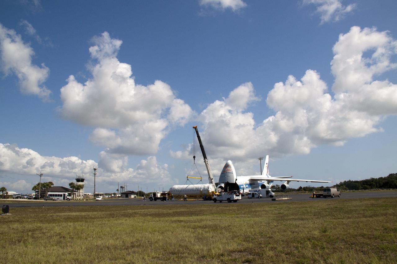 CAPE CANAVERAL, Fla. -- On the Skid Strip at Cape Canaveral Air Force Station in Florida, workers use a crane to lower the Centaur upper stage of the United Launch Alliance Atlas V rocket slated to launch NASA's Juno spacecraft onto a transporter.        NASA's Juno spacecraft is scheduled to launch aboard the Atlas V from Cape Canaveral, Fla. Aug. 5.The solar-powered spacecraft will orbit Jupiter's poles 33 times to find out more about the gas giant's origins, structure, atmosphere and magnetosphere and investigate the existence of a solid planetary core. For more information visit: www.nasa.gov/juno. Photo credit: NASA/Jack Pfaller