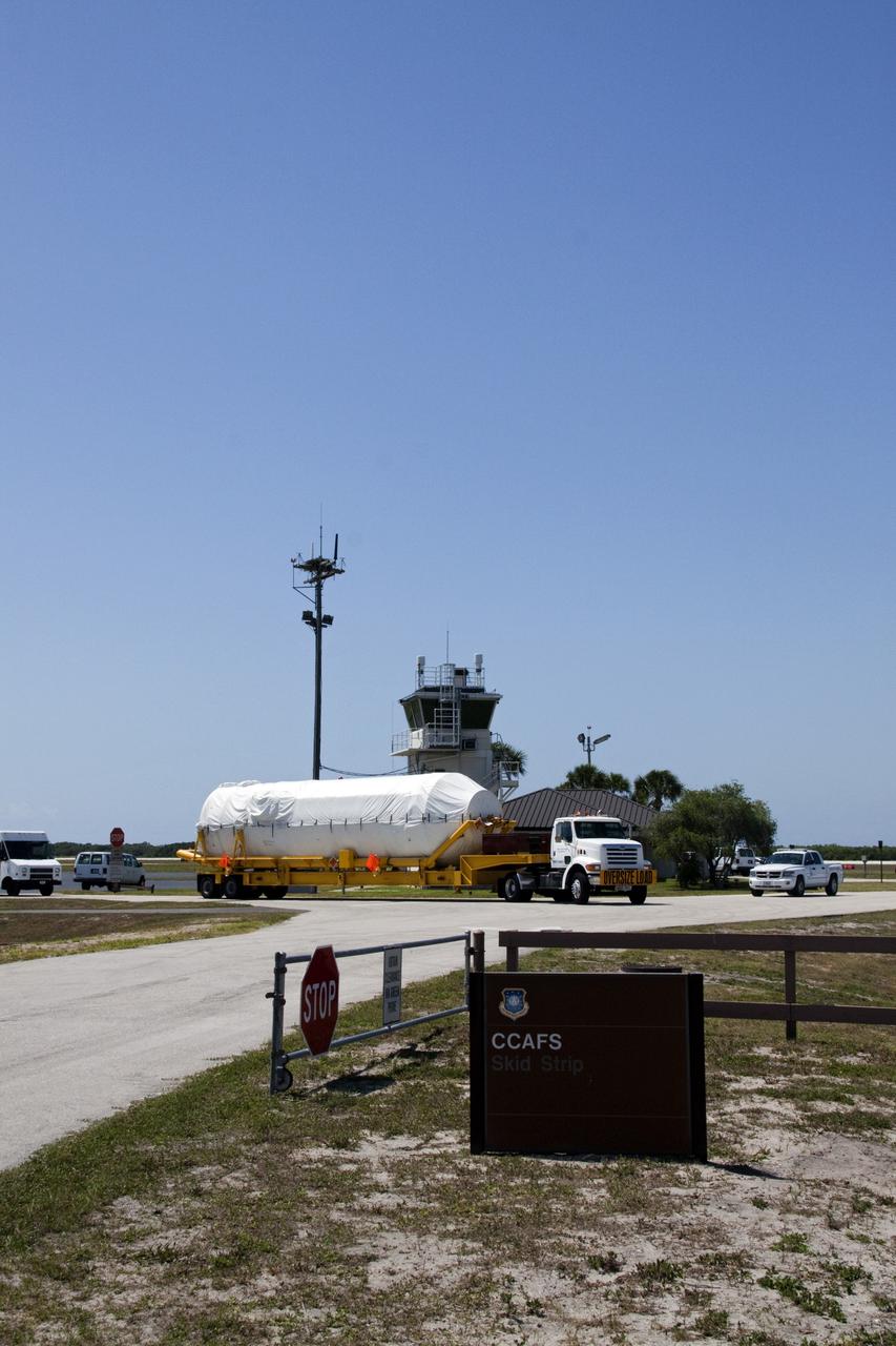CAPE CANAVERAL, Fla. -- The Centaur upper stage for the United Launch Alliance Atlas V rocket slated to launch NASA's Juno spacecraft is being transported from the Skid Strip on Cape Canaveral Air Force Station in Florida to the Atlas Spaceflight Operations Center.      NASA's Juno spacecraft is scheduled to launch aboard the Atlas V from Cape Canaveral, Fla. Aug. 5.The solar-powered spacecraft will orbit Jupiter's poles 33 times to find out more about the gas giant's origins, structure, atmosphere and magnetosphere and investigate the existence of a solid planetary core. For more information visit: www.nasa.gov/juno. Photo credit: NASA/Jack Pfaller
