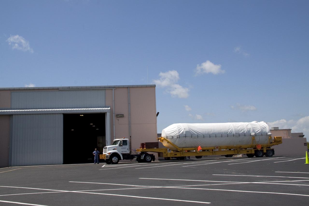 CAPE CANAVERAL, Fla. -- The Centaur upper stage for the United Launch Alliance Atlas V rocket slated to launch NASA's Juno spacecraft has been transported from the Skid Strip on Cape Canaveral Air Force Station in Florida to the Atlas Spaceflight Operations Center.        NASA's Juno spacecraft is scheduled to launch aboard the Atlas V from Cape Canaveral, Fla. Aug. 5.The solar-powered spacecraft will orbit Jupiter's poles 33 times to find out more about the gas giant's origins, structure, atmosphere and magnetosphere and investigate the existence of a solid planetary core. For more information visit: www.nasa.gov/juno. Photo credit: NASA/Jack Pfaller