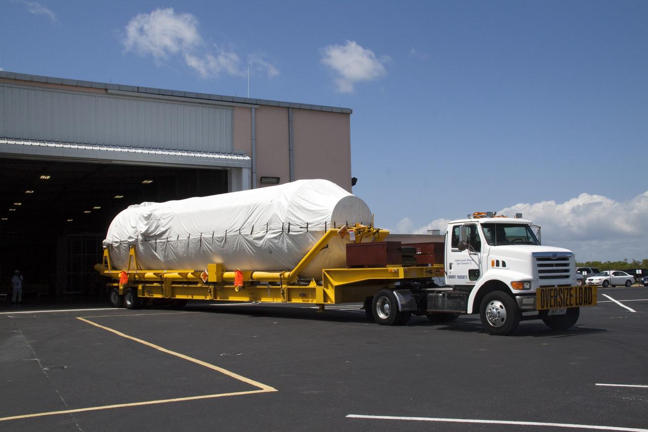 CAPE CANAVERAL, Fla. -- The Centaur upper stage for the United Launch Alliance Atlas V rocket slated to launch NASA's Juno spacecraft is being delivered to the Atlas Spaceflight Operations Center.      NASA's Juno spacecraft is scheduled to launch aboard the Atlas V from Cape Canaveral, Fla. Aug. 5.The solar-powered spacecraft will orbit Jupiter's poles 33 times to find out more about the gas giant's origins, structure, atmosphere and magnetosphere and investigate the existence of a solid planetary core. For more information visit: www.nasa.gov/juno. Photo credit: NASA/Jack Pfaller
