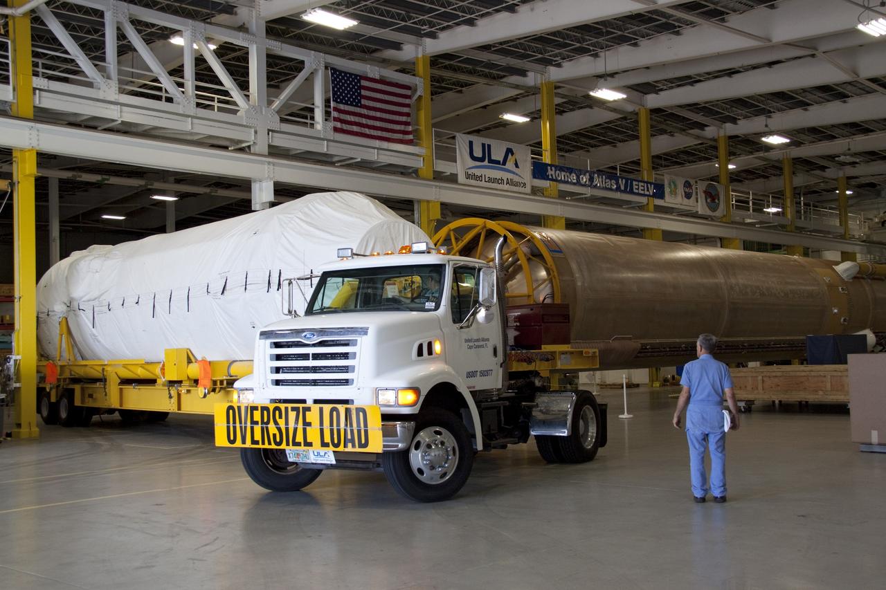 CAPE CANAVERAL, Fla. -- The Centaur upper stage for the United Launch Alliance Atlas V rocket slated to launch NASA's Juno spacecraft has been delivered to the Atlas Spaceflight Operations Center.        NASA's Juno spacecraft is scheduled to launch aboard the Atlas V from Cape Canaveral, Fla. Aug. 5.The solar-powered spacecraft will orbit Jupiter's poles 33 times to find out more about the gas giant's origins, structure, atmosphere and magnetosphere and investigate the existence of a solid planetary core. For more information visit: www.nasa.gov/juno. Photo credit: NASA/Jack Pfaller