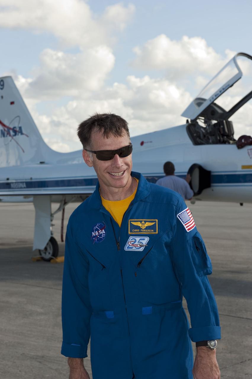 CAPE CANAVERAL, Fla. -- STS-135 Commander Chris Ferguson is greeted on the Shuttle Landing Facility at NASA's Kennedy Space Center in Florida. The flight crew of four arrived aboard T-38 training jets to watch two historic milestones of NASA's Space Shuttle Program -- the final landing of shuttle Endeavour, which will bookend its STS-134 mission to the International Space Station, and the final rollout of their vehicle, space shuttle Atlantis, to Launch Pad 39A.    STS-135 will be the 33rd flight of Atlantis, the 37th shuttle mission to the space station, and the 135th and final mission of the shuttle program. For more information visit, www.nasa.gov/mission_pages/shuttle/shuttlemissions/sts135/index.html. Photo credit: NASA/Kim Shiflett