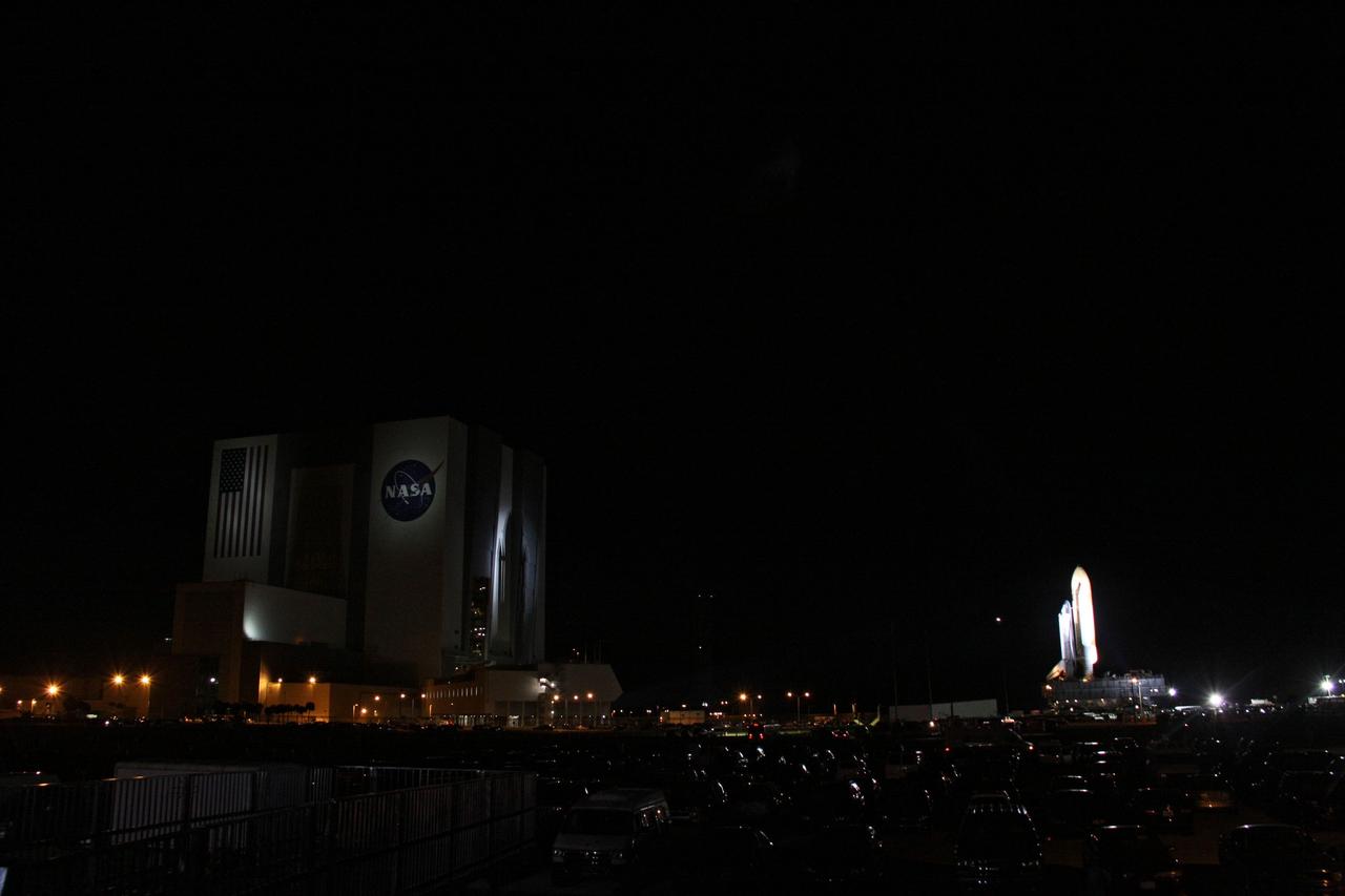 CAPE CANAVERAL, Fla. -- Space shuttle Atlantis leaves its iconic silhouette on the Vehicle Assembly Building as it makes its final journey to Launch Pad 39A at NASA's Kennedy Space Center in Florida. First motion was at 8:42 p.m. EDT. It will take the crawler-transporter about six hours to carry the shuttle, attached to its external fuel tank and solid rocket boosters, to the seaside launch pad. The milestone move paves the way for the launch of the STS-135 mission to the International Space Station, targeted for July 8.        STS-135 will be the 33rd flight of Atlantis, the 37th shuttle mission to the space station, and the 135th and final mission of NASA's Space Shuttle Program. For more information visit, www.nasa.gov/mission_pages/shuttle/shuttlemissions/sts135/index.html. Photo credit: NASA/Troy Cryder