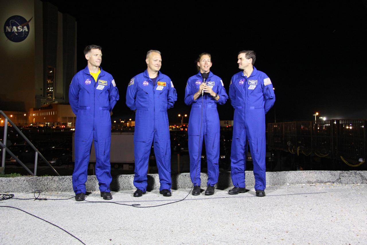CAPE CANAVERAL, Fla. -- STS-135 Commander Chris Ferguson, left, Pilot Doug Hurley, and Mission Specialists Sandy Magnus and Rex Walheim talk to media as their vehicle, space shuttle Atlantis, makes its final journey from the Vehicle Assembly Building to Launch Pad 39A at NASA's Kennedy Space Center in Florida. First motion was at 8:42 p.m. EDT. It will take the crawler-transporter about six hours to carry the shuttle, attached to its external fuel tank and solid rocket boosters, to the seaside launch pad. The milestone move paves the way for the launch of the STS-135 mission to the International Space Station, targeted for July 8.      STS-135 will be the 33rd flight of Atlantis, the 37th shuttle mission to the space station, and the 135th and final mission of NASA's Space Shuttle Program. For more information visit, www.nasa.gov/mission_pages/shuttle/shuttlemissions/sts135/index.html. Photo credit: NASA/Troy Cryder