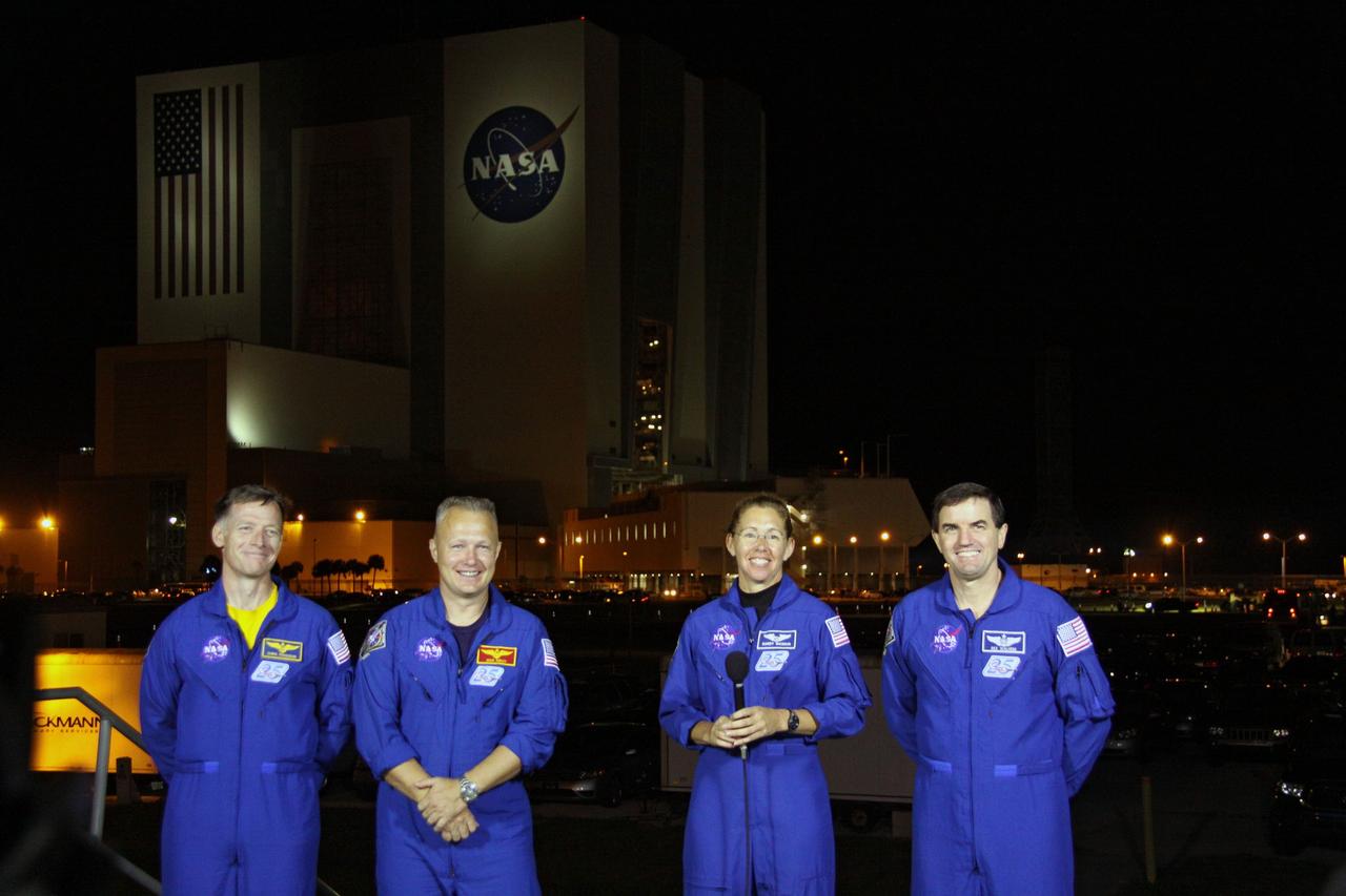 CAPE CANAVERAL, Fla. -- STS-135 Commander Chris Ferguson, left, Pilot Doug Hurley, and Mission Specialists Sandy Magnus and Rex Walheim talk to media as their vehicle, space shuttle Atlantis, makes its final journey from the Vehicle Assembly Building to Launch Pad 39A at NASA's Kennedy Space Center in Florida. First motion was at 8:42 p.m. EDT. It will take the crawler-transporter about six hours to carry the shuttle, attached to its external fuel tank and solid rocket boosters, to the seaside launch pad. The milestone move paves the way for the launch of the STS-135 mission to the International Space Station, targeted for July 8. STS-135 will be the 33rd flight of Atlantis, the 37th shuttle mission to the space station, and the 135th and final mission of NASA's Space Shuttle Program. For more information visit, www.nasa.gov/mission_pages/shuttle/shuttlemissions/sts135/index.html. Photo credit: NASA/Troy Cryder