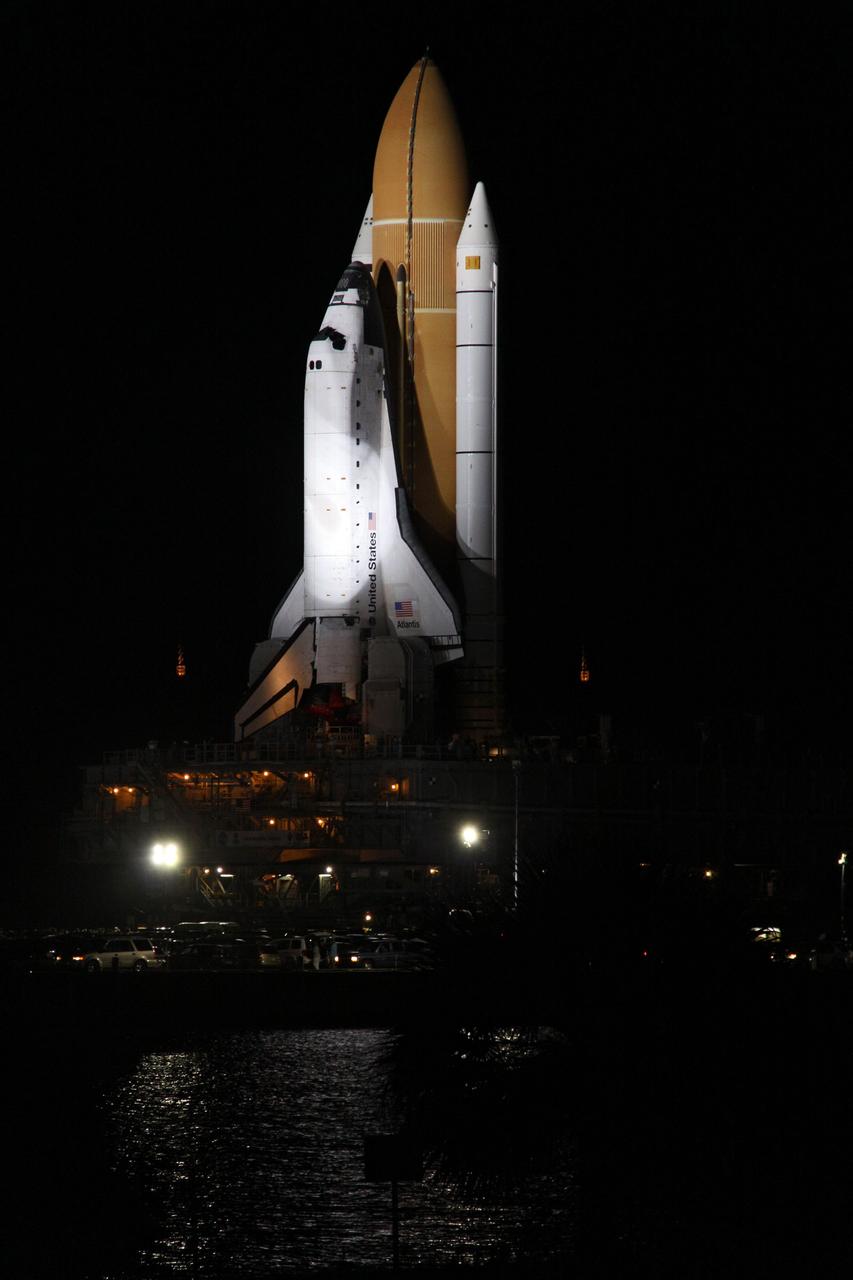 CAPE CANAVERAL, Fla. -- Bathed in xenon lights, space shuttle Atlantis passes the Turn Basin as it makes its final journey from the Vehicle Assembly Building to Launch Pad 39A at NASA's Kennedy Space Center in Florida. First motion was at 8:42 p.m. EDT. It will take the crawler-transporter about six hours to carry the shuttle, attached to its external fuel tank and solid rocket boosters, to the seaside launch pad. The milestone move paves the way for the launch of the STS-135 mission to the International Space Station, targeted for July 8.        STS-135 will be the 33rd flight of Atlantis, the 37th shuttle mission to the space station, and the 135th and final mission of NASA's Space Shuttle Program. For more information visit, www.nasa.gov/mission_pages/shuttle/shuttlemissions/sts135/index.html. Photo credit: NASA/Troy Cryder