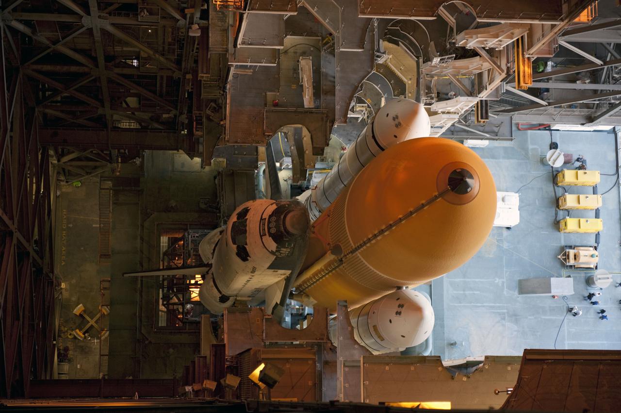 CAPE CANAVERAL, Fla. -- Space shuttle Atlantis, attached to its external fuel tank and solid rocket boosters atop a mobile launcher platform, awaits its final journey from the Vehicle Assembly Building to Launch Pad 39A at NASA's Kennedy Space Center in Florida. "Rollout," as it's called, began at 8:42 p.m. EDT. It will take the crawler-transporter about six hours to carry the shuttle stack to its seaside launch pad. The milestone move paves the way for the launch of the STS-135 mission to the International Space Station, targeted for July 8.      STS-135 will be the 33rd flight of Atlantis, the 37th shuttle mission to the space station, and the 135th and final mission of NASA's Space Shuttle Program. For more information visit, www.nasa.gov/mission_pages/shuttle/shuttlemissions/sts135/index.html. Photo credit: NASA/Kim Shiflett